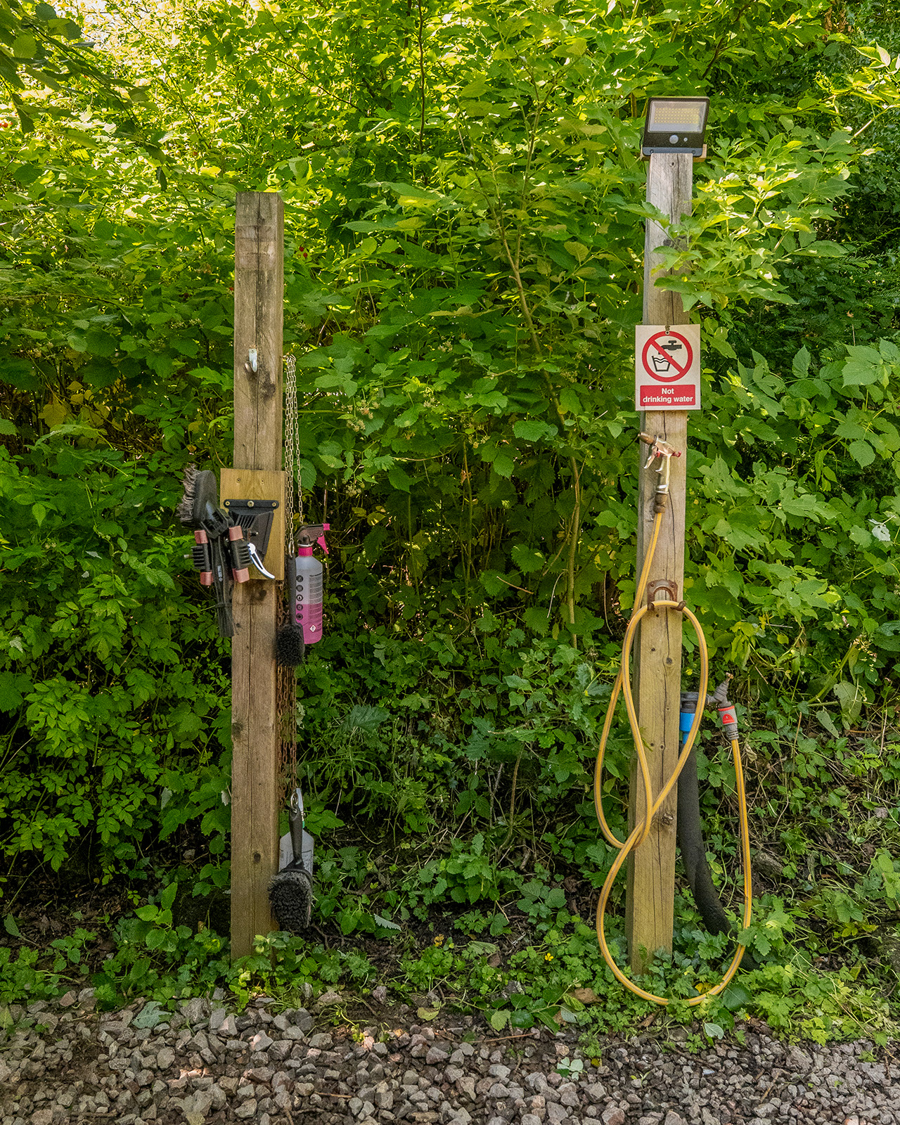 The bike repair and washing area at Roost Merthyr Tydfil, with practical facilities for guests maintaining their bicycles after exploring the South Wales countryside.