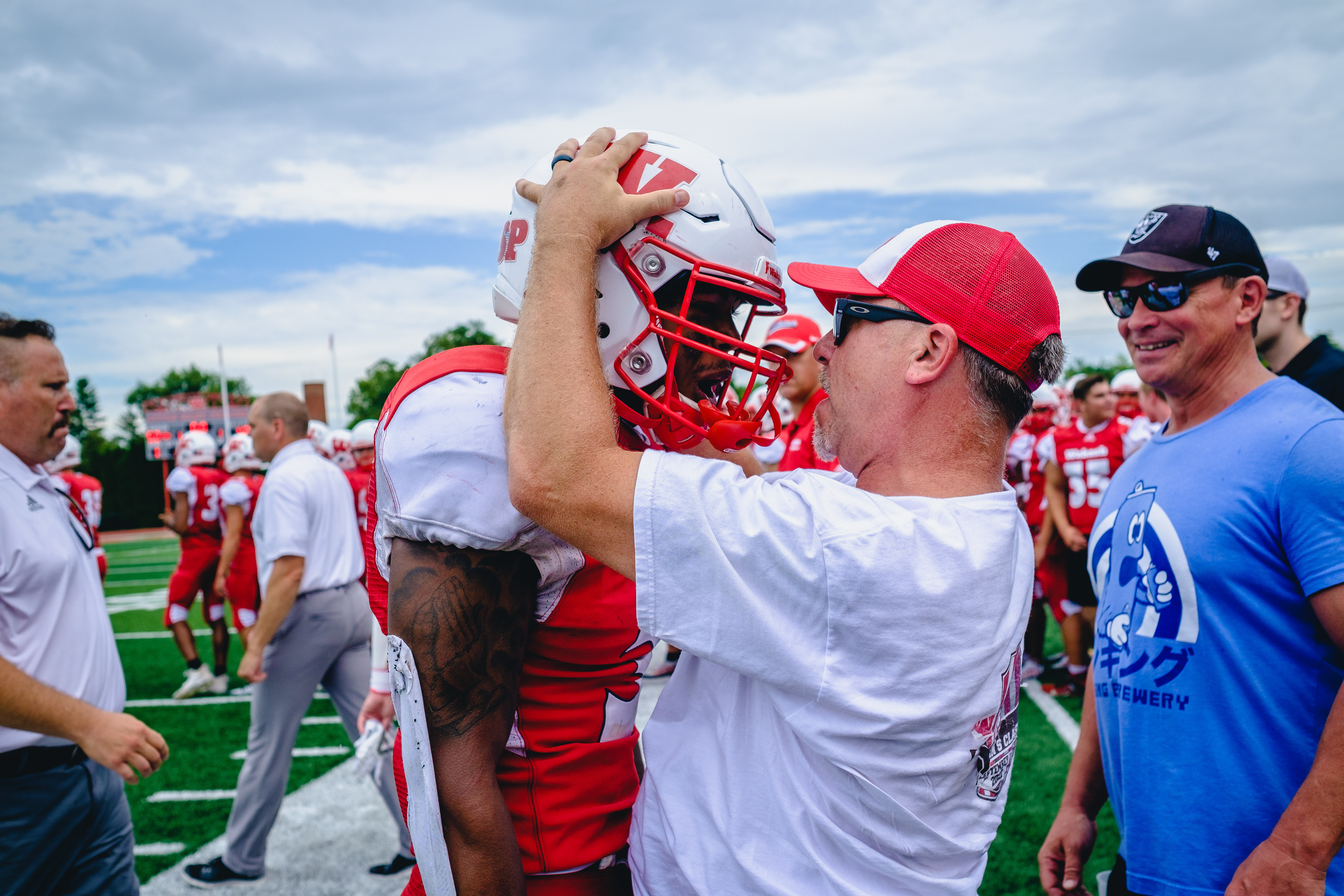 CRAWFORDSVILLE, IN – September 03, 2022 – Wide Receiver Derek Allen Jr. #3 of the Wabash Little Giants interacts with a fan after the game against the Hampden-Sydney Tigers and the Wabash Little Giants at Little Giant Stadium in Crawfordsville, IN.