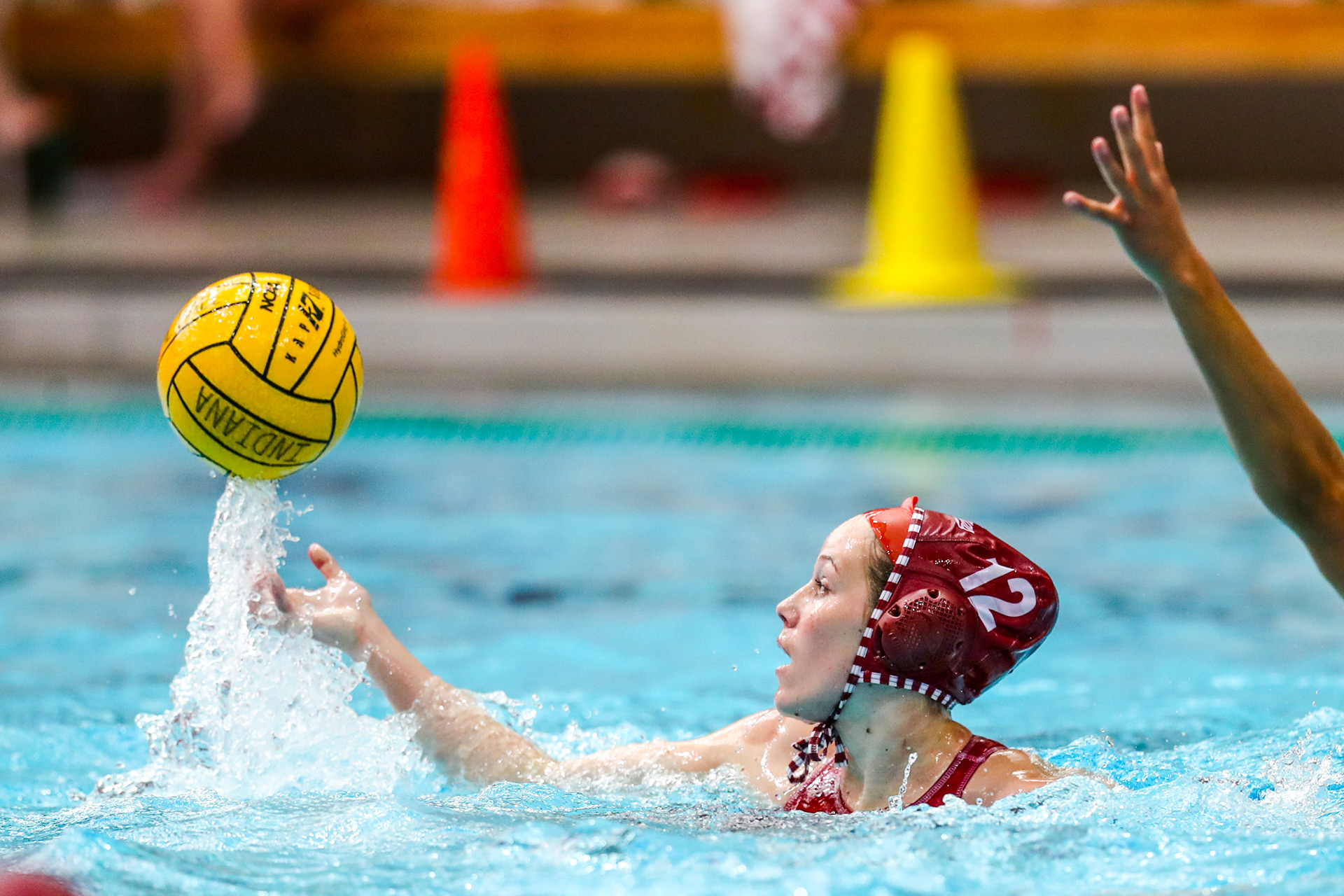 BLOOMINGTON, IN - April 13, 2021 - attacker Tina Doherty #12 of the Indiana Hoosiers during the game against the UCLA Bruins and the Indiana Hoosiers at Counsilman-Billingsley Aquatic Center in Bloomington, IN. 