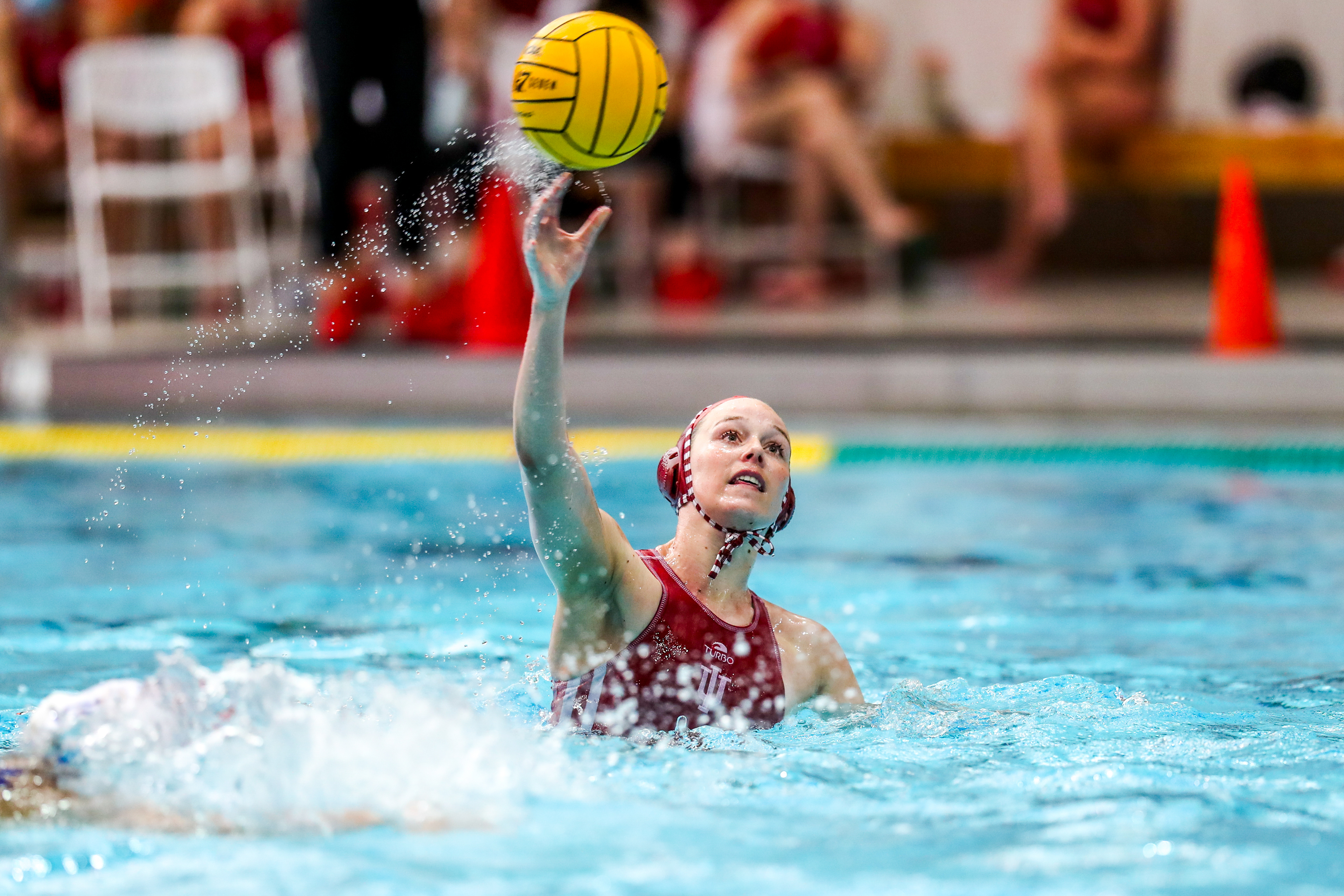 BLOOMINGTON, IN - April 13, 2021 - attacker Tina Doherty #12 of the Indiana Hoosiers during the game against the UCLA Bruins and the Indiana Hoosiers at Counsilman-Billingsley Aquatic Center in Bloomington, IN.