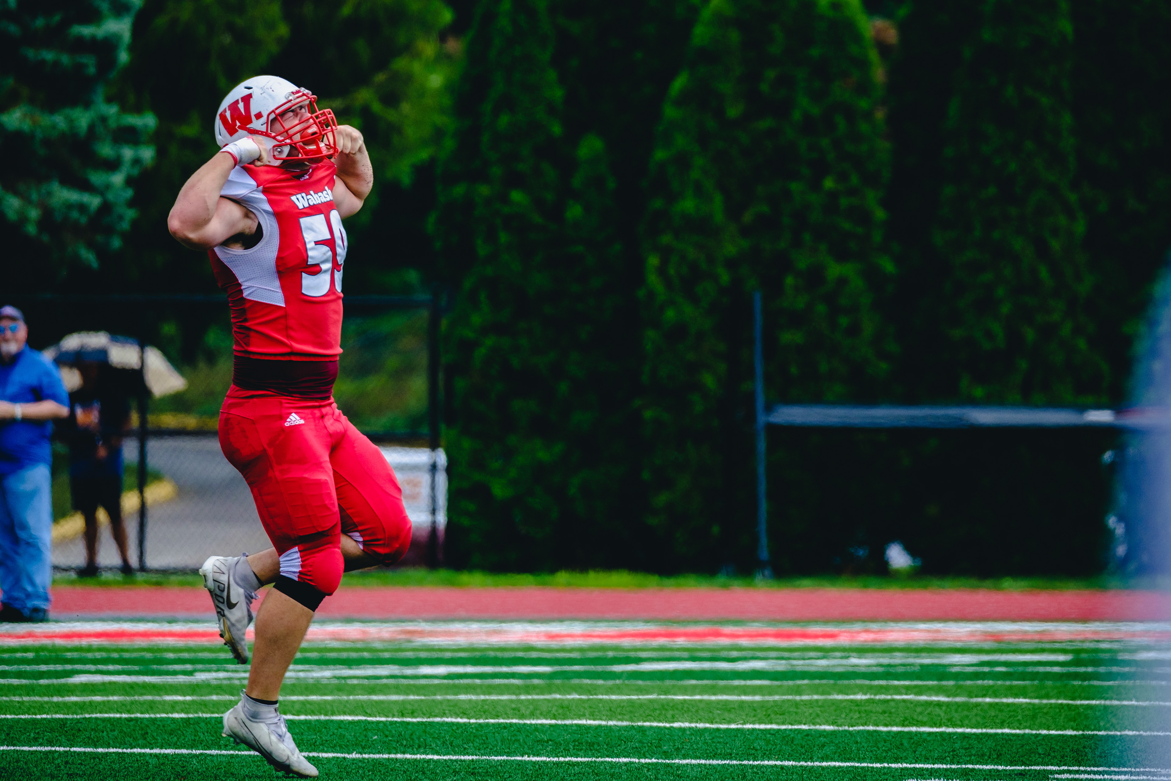CRAWFORDSVILLE, IN – September 03, 2022 – Linebacker Reilly Granger #55 of the Wabash Little Giants cheers during the game against the Hampden-Sydney Tigers and the Wabash Little Giants at Little Giant Stadium in Crawfordsville, IN. 