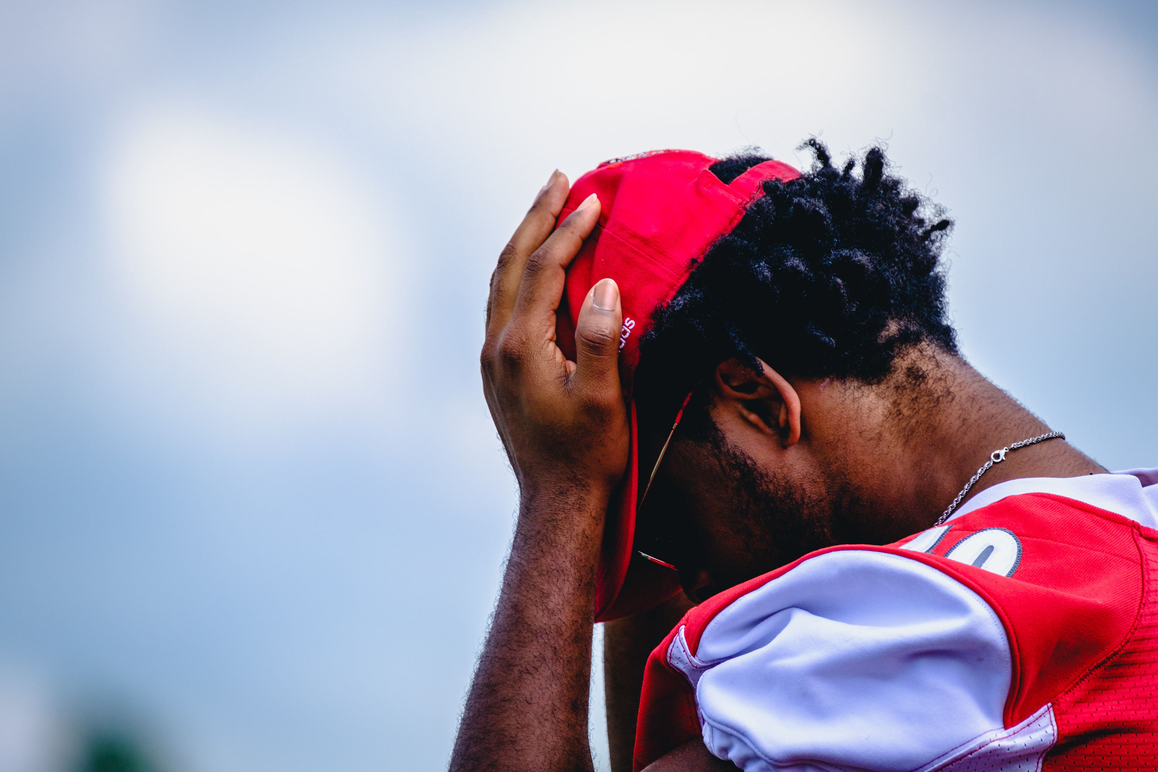 CRAWFORDSVILLE, IN – September 10, 2022 – A player of the Wabash Little Giants puts his face in his hands during the game against the North Central Cardinals and the Wabash Little Giants at Little Giant Stadium in Crawfordsville, IN. 