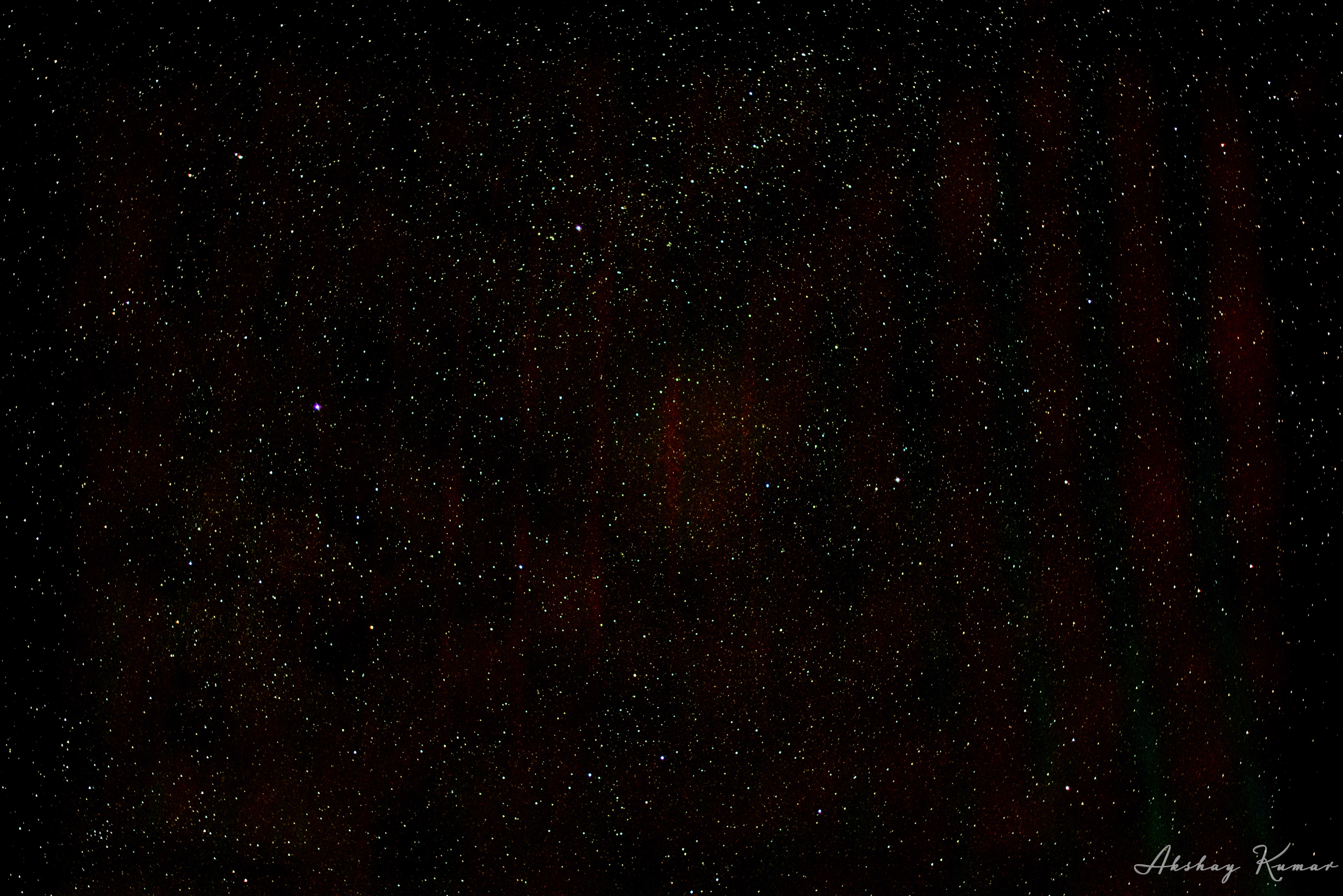 Part of Cygnus constellation in night sky. Tagged stars and nebulae include North America Nebula, NGC7000, NGC6992, Veil Nebula, NGC6960, Pelican Nebula, IC5070, IC5068, IC1340, 41Cyg, νCyg,32Cyg, τCyg, ξCyg, 31Cyg, ζCyg, Gienah, Sadr and Deneb. Since it was in the center of galactic center, some color details are also visible (though they have been ashed off significantly to eliminate light pollution effects)