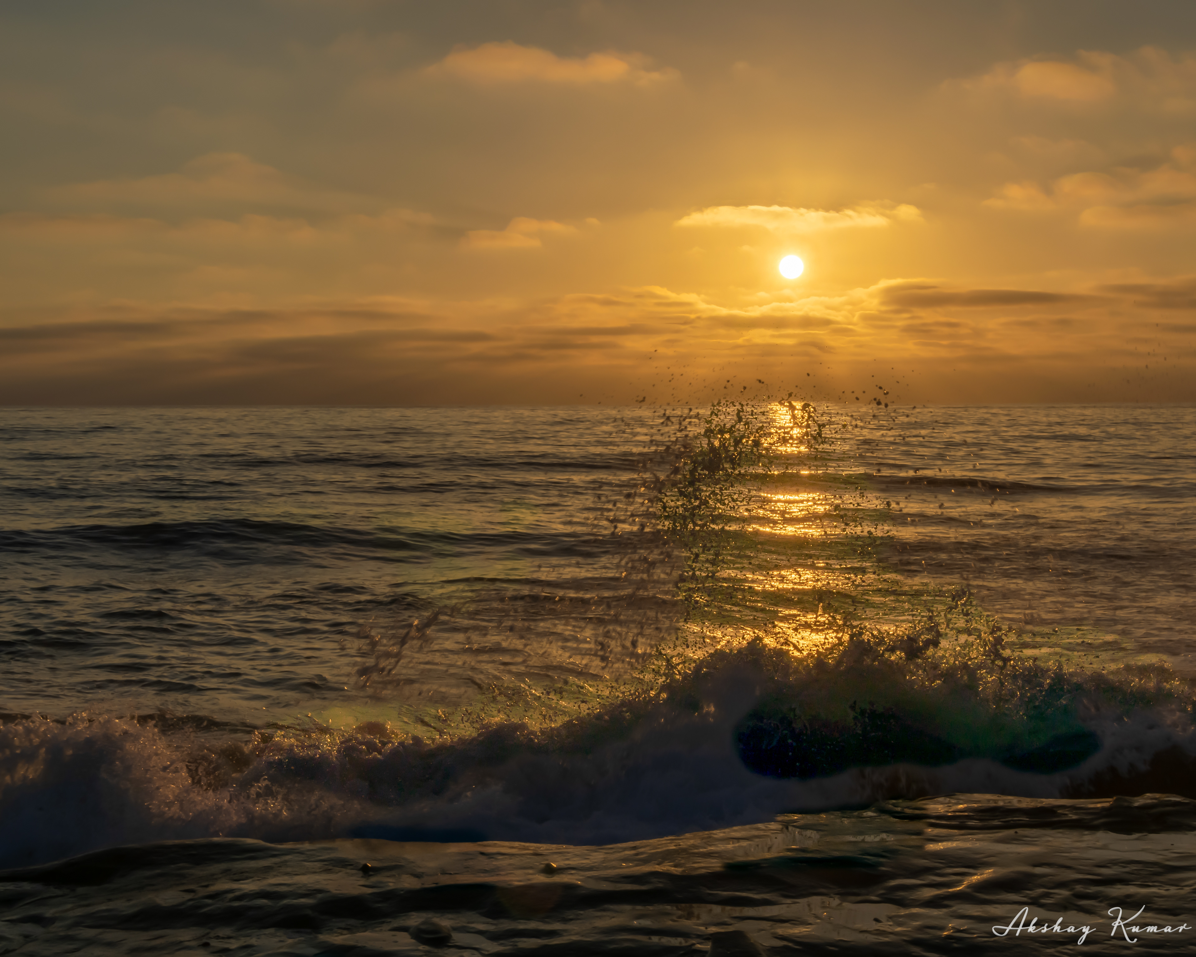 Sea waves crashing against a rock at La Jolla Cave