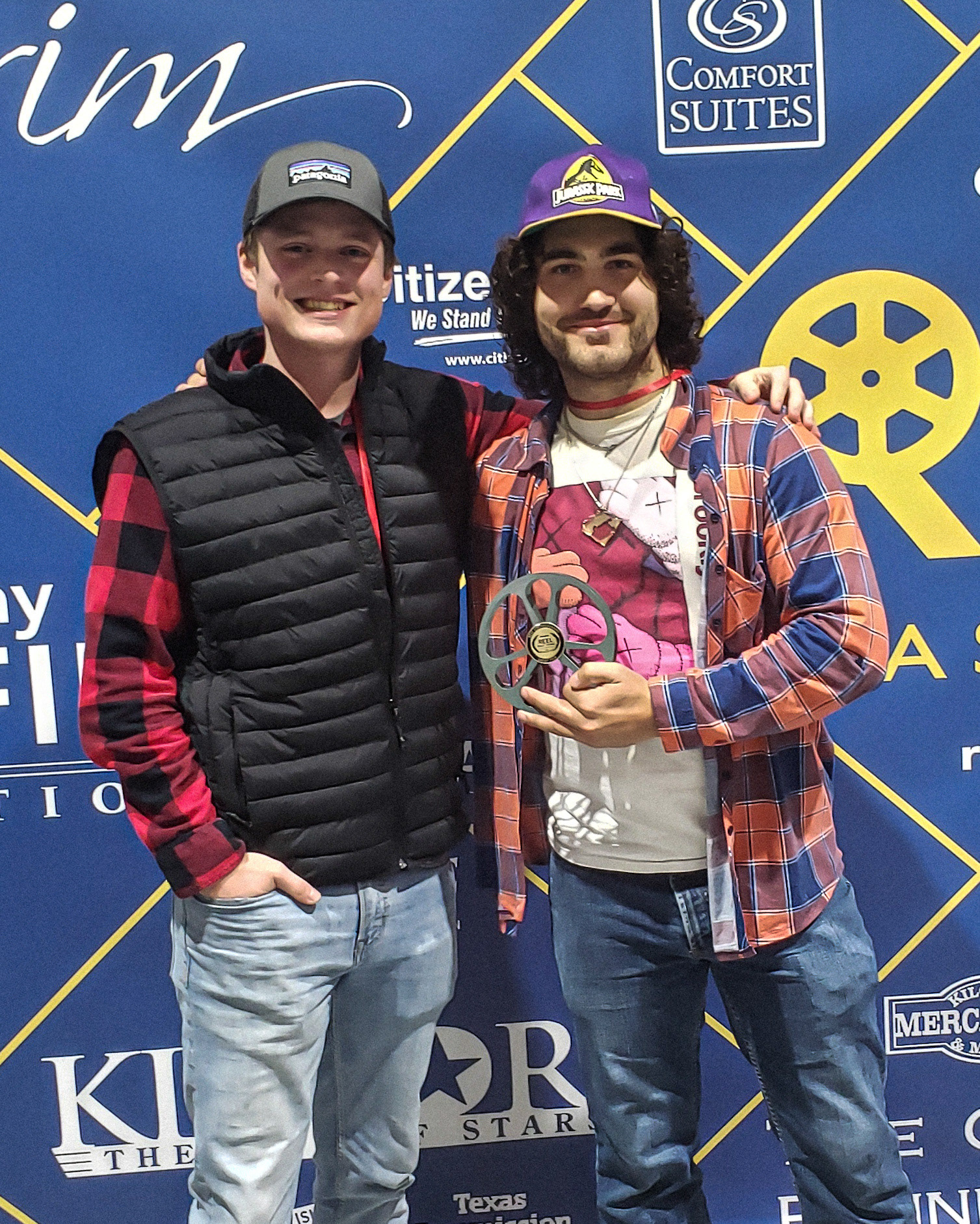 Buddy Love and Sam Casey holding the award for Best Cinematography for Kingdom Come at the Reel East Texas Film Festival