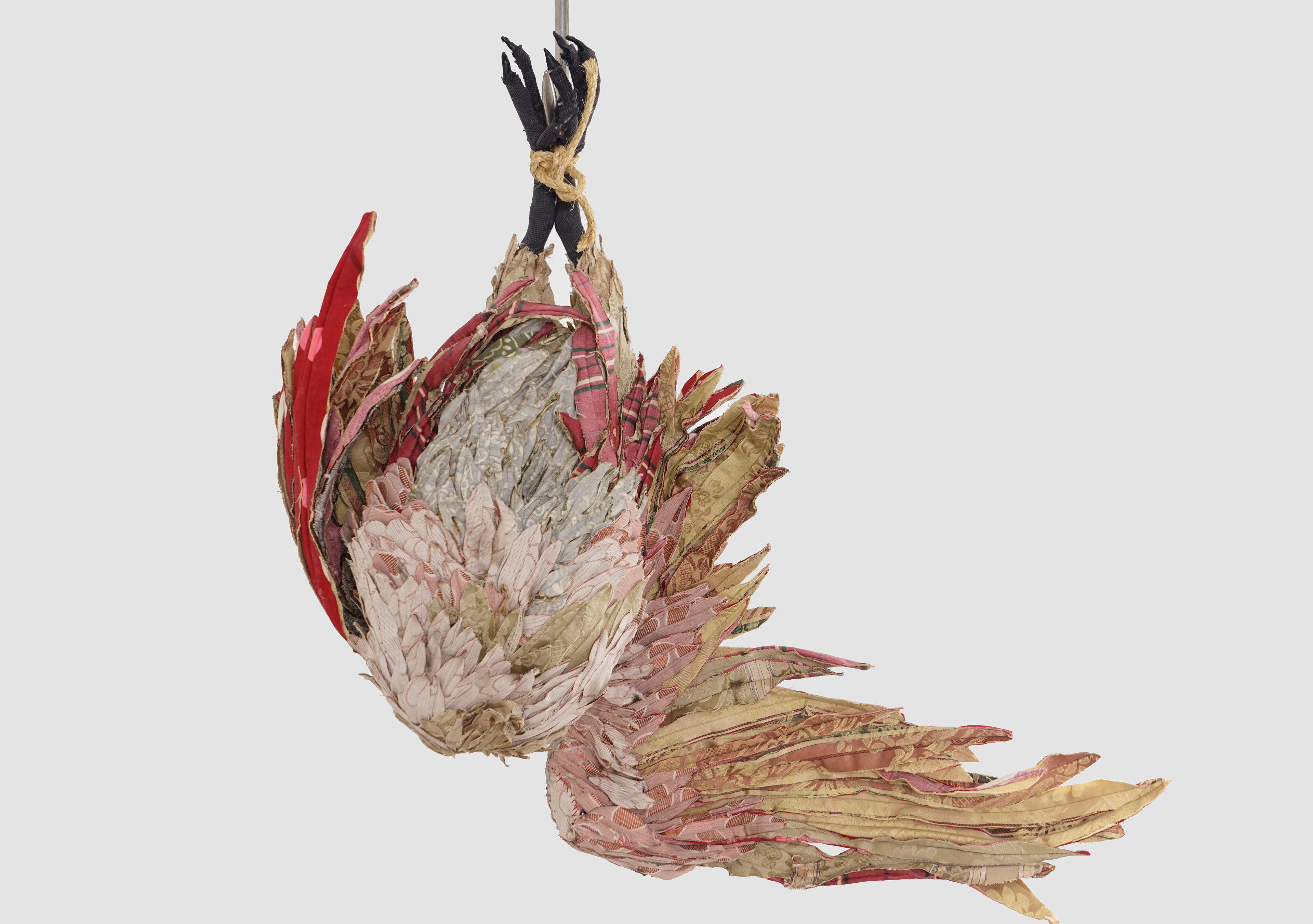 "Apotropaic" 2015 | Discarded clothing, discarded upholstery fabric, meat hooks, chain | 33 x 34 x 18 in.