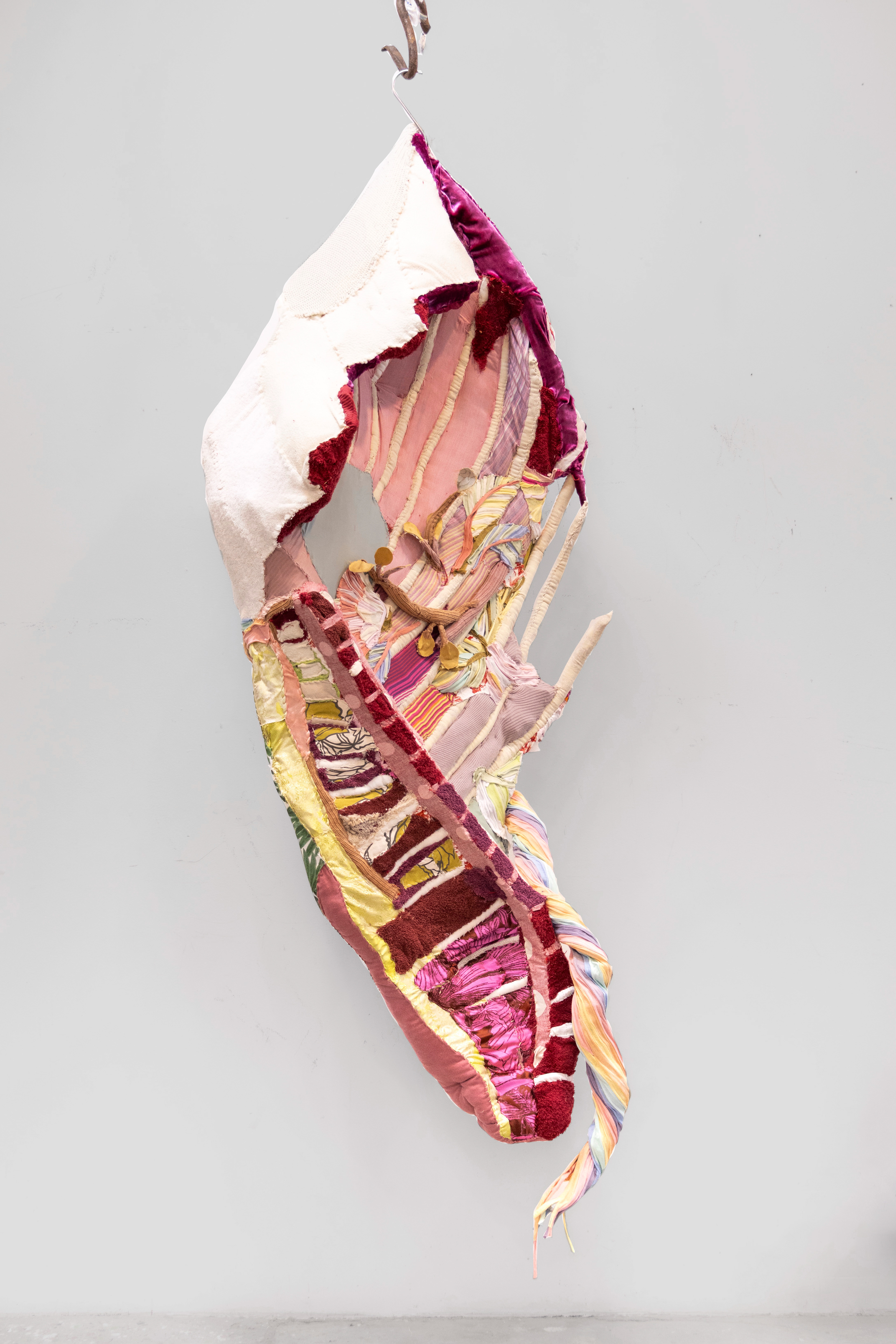 "In the Shape of Home" 2024 | Discarded textiles | 74 x 29 x 12 in.