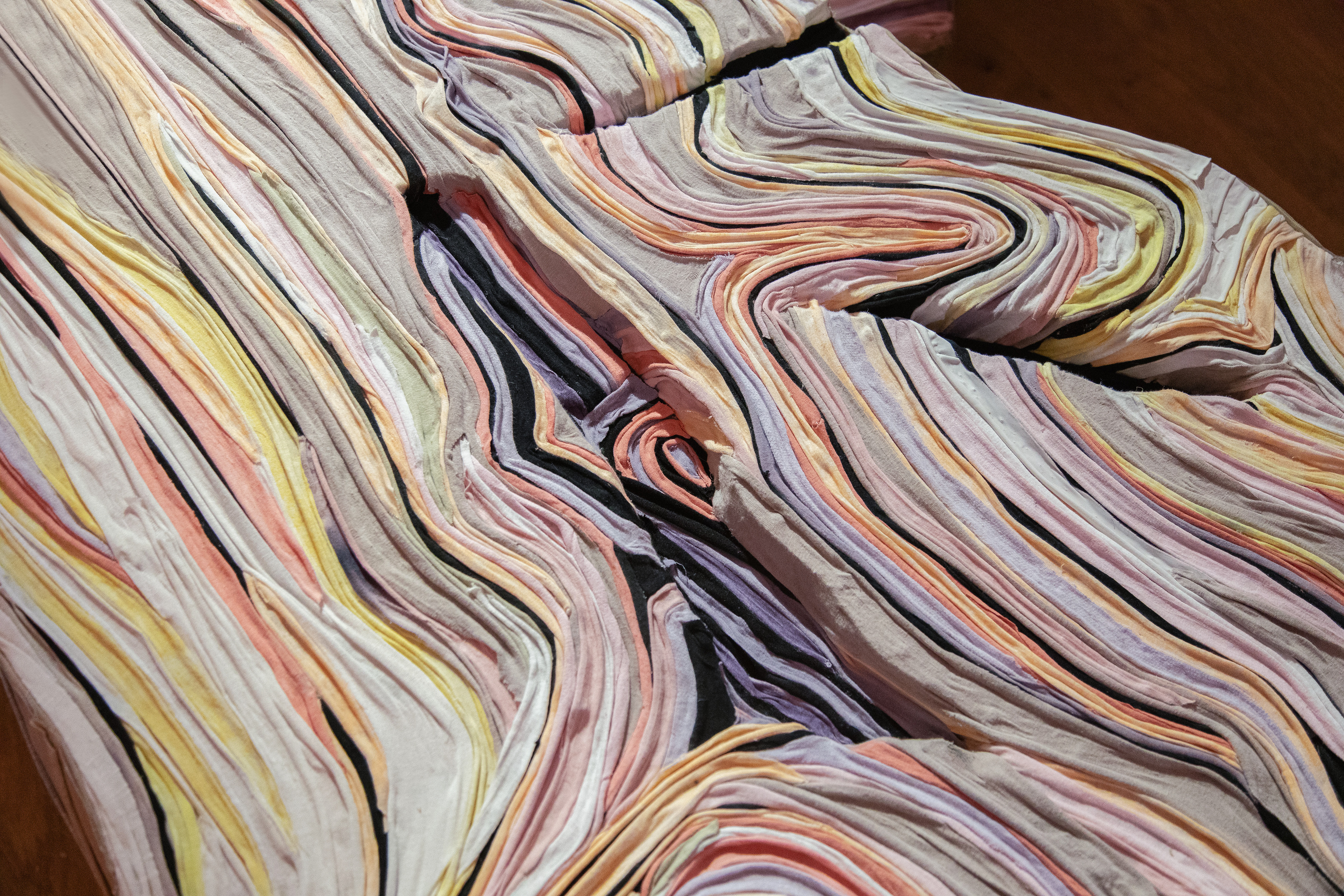 "Second Skin" 2025 (Detail) | Discarded textiles | 33.9 x 6.6 x 2.7 ft.