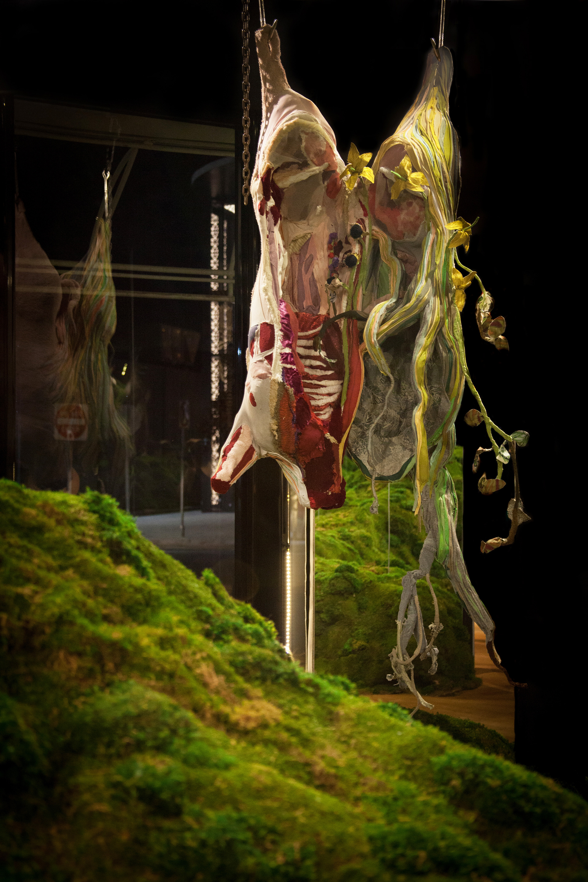 "Alchemy" 2019 (Installation view, Istituto Marangoni, Miami FL) | Discarded clothing, moss, meat hooks