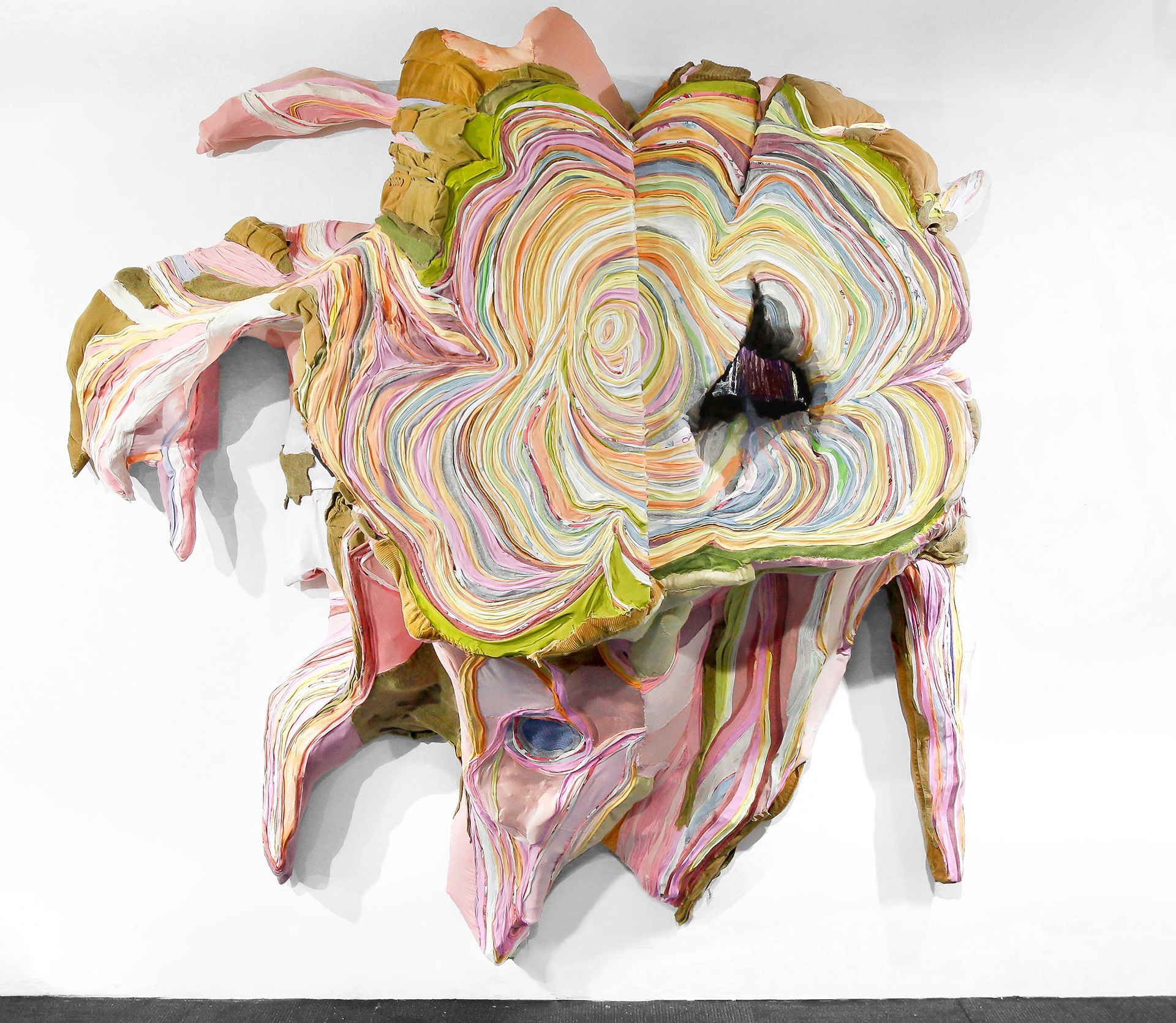 "Rosewood Root" 2020 | Discarded Clothing, video screen | 80 x 82 x 36 in.