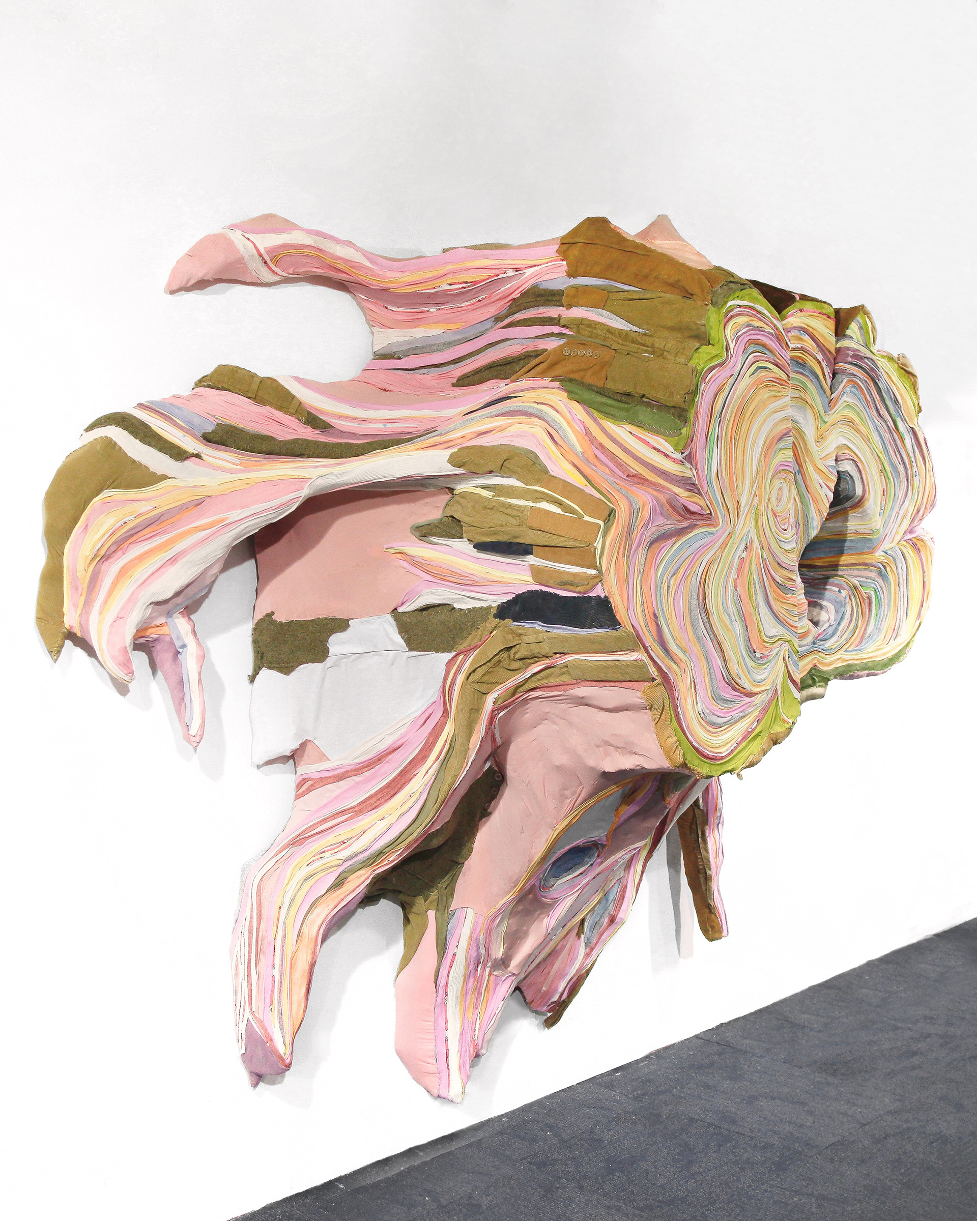 "Rosewood Root" 2020 | Discarded Clothing, video screen | 80 x 82 x 36 in.