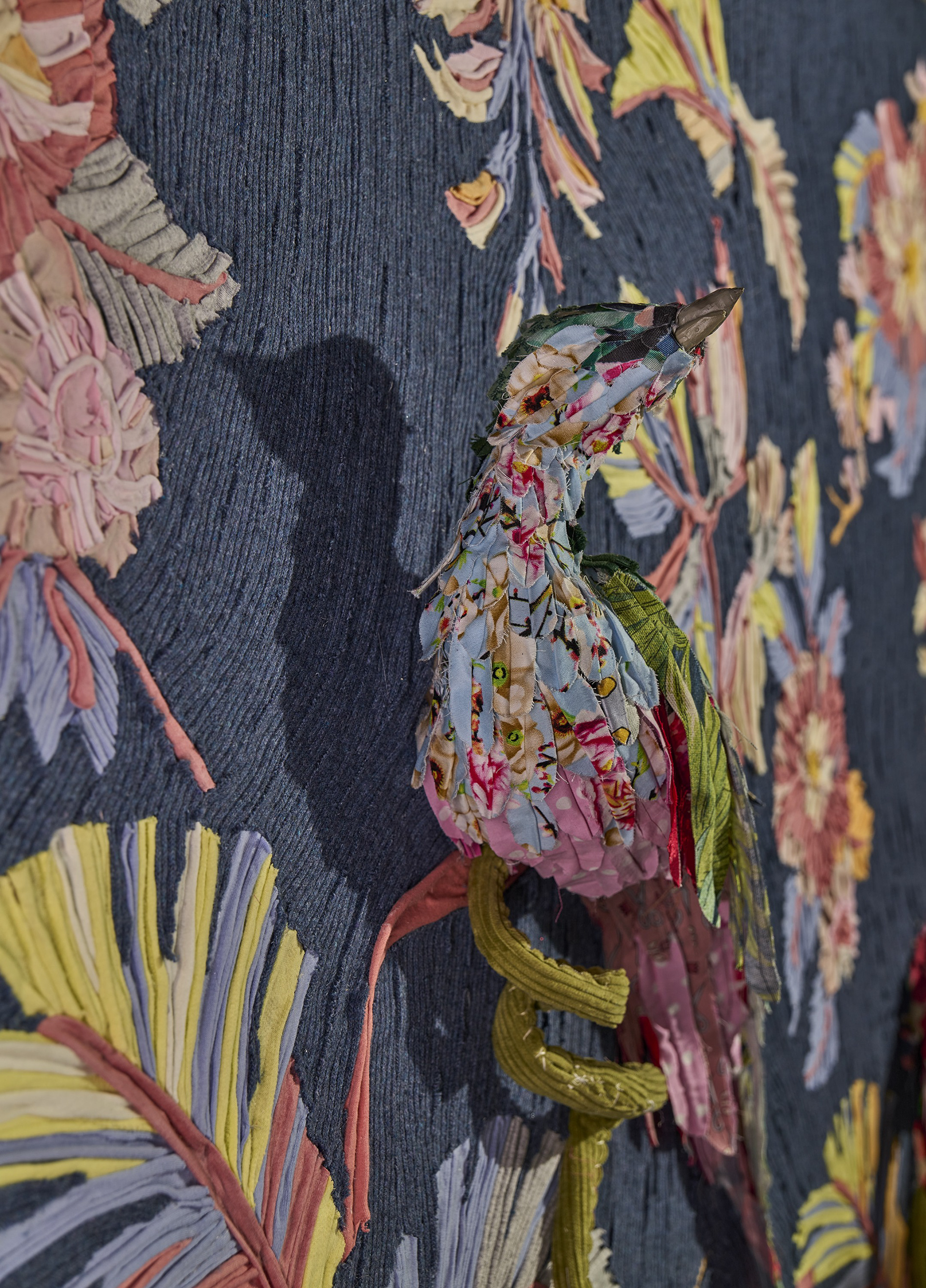 "The Conference of the Birds" 2021 (Detail) | Discarded Textiles, acrylic nails | 48 x 94 x 7 in.