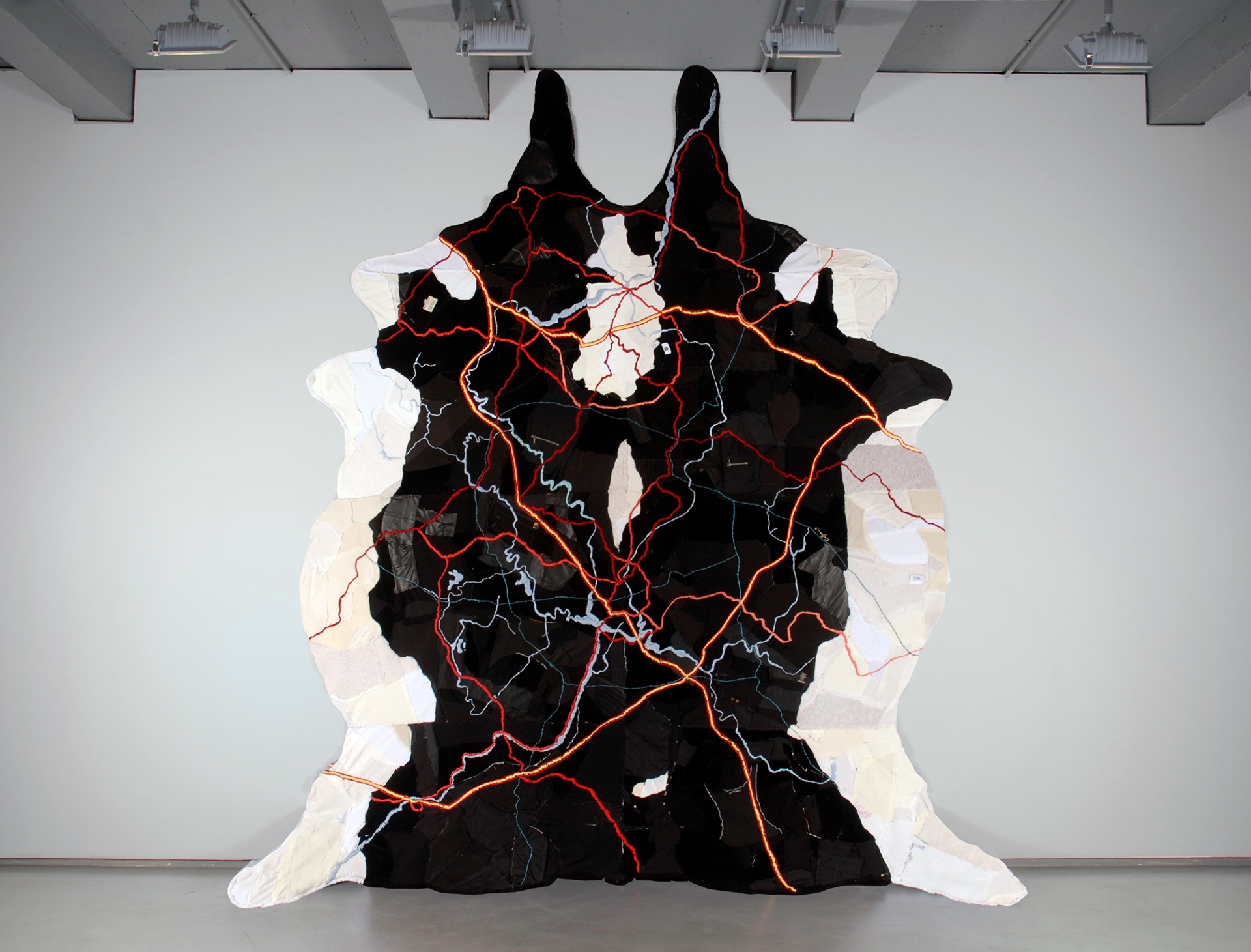 "Map of Truth" 2008 | Discarded Clothing belonging to the Artist, Wood, Embroidery Floss | 132 x 93 in.