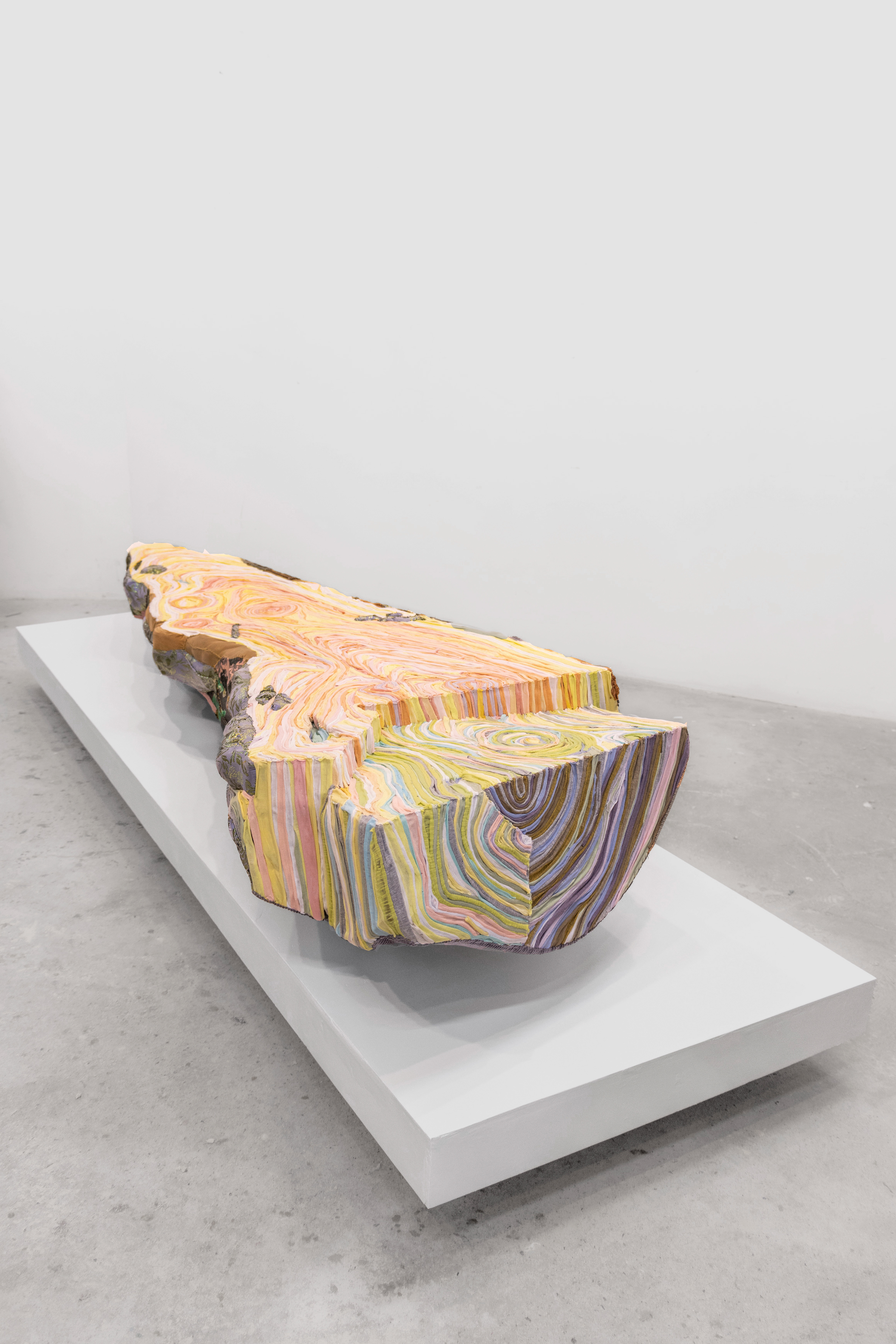 "Sunrise" 2024 | Discarded textiles on wood | 105 x 30 x 15 in.