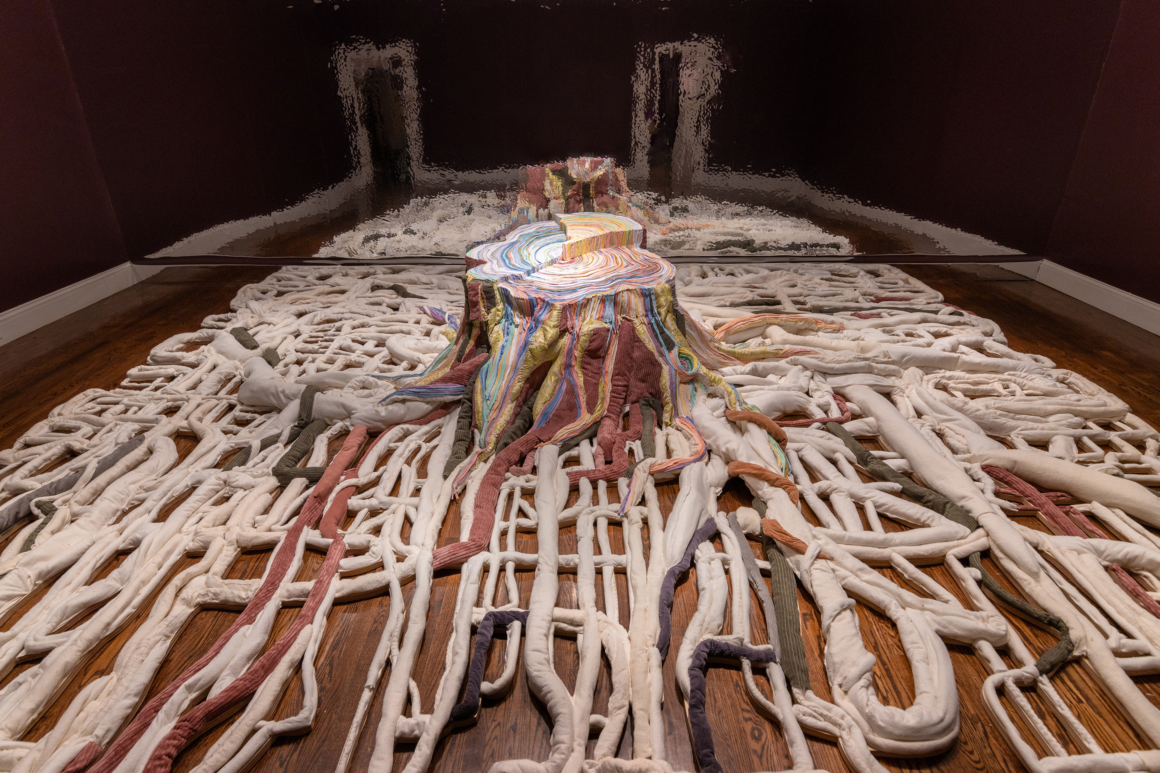 "Narcissus" 2025 | Discarded textiles, wood | 20 x 16 x 3.5 ft.