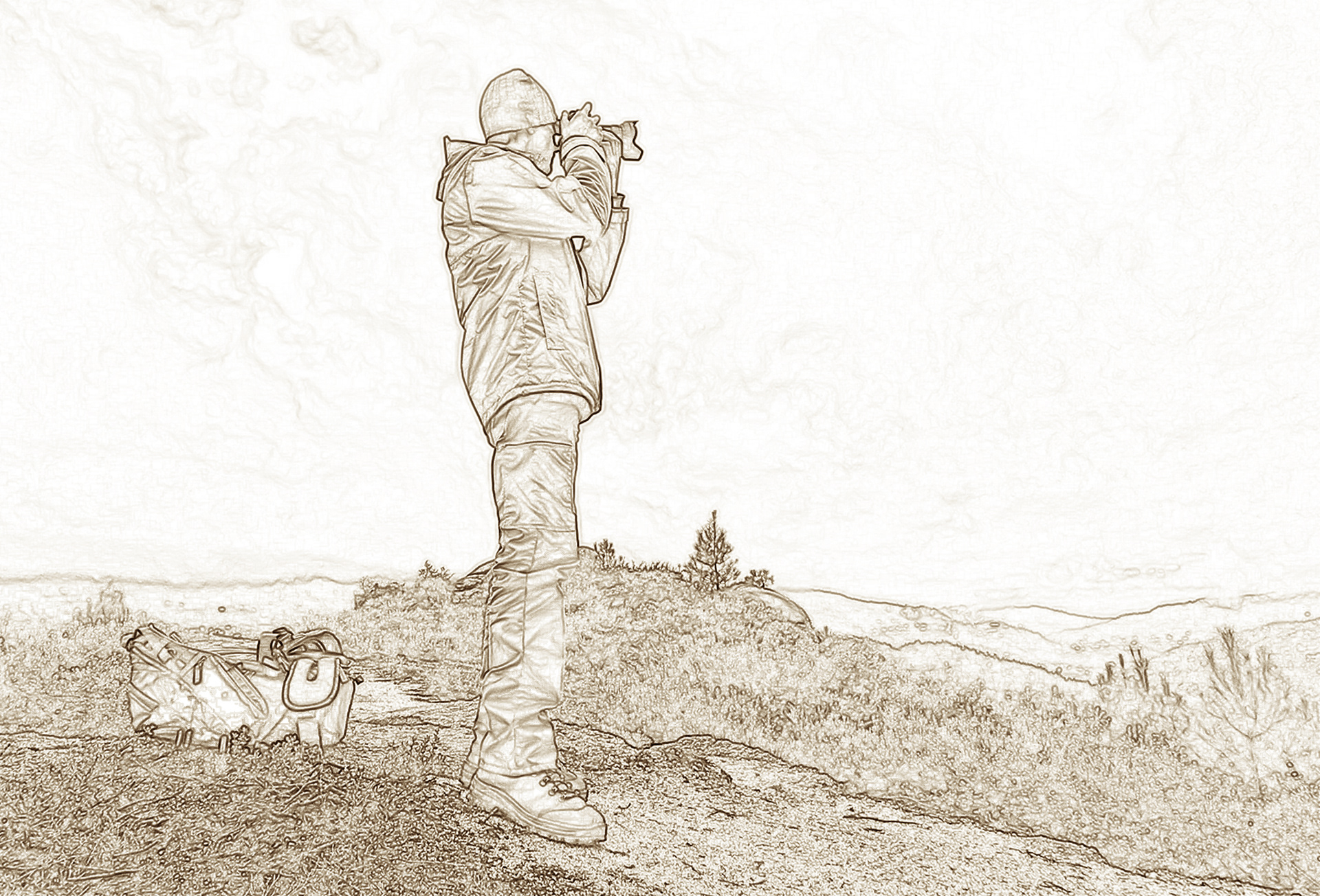 Fernando Santos at the top of a hill taking a photograph hand held camera