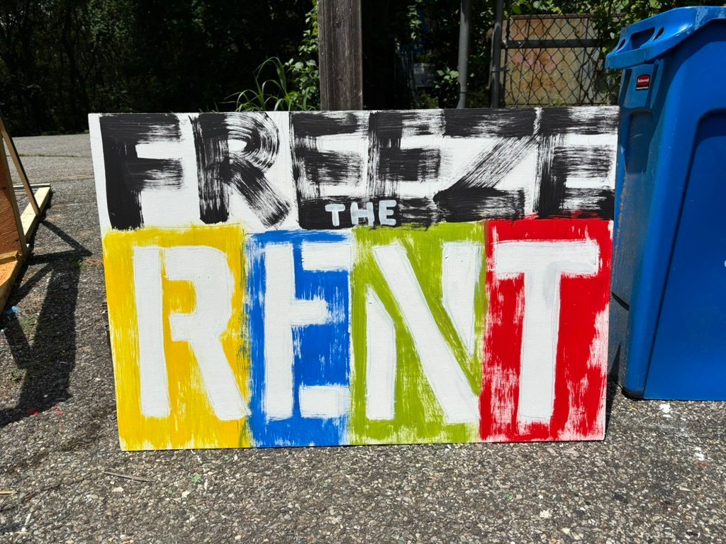 Freeze the RENT poster, "RENT"