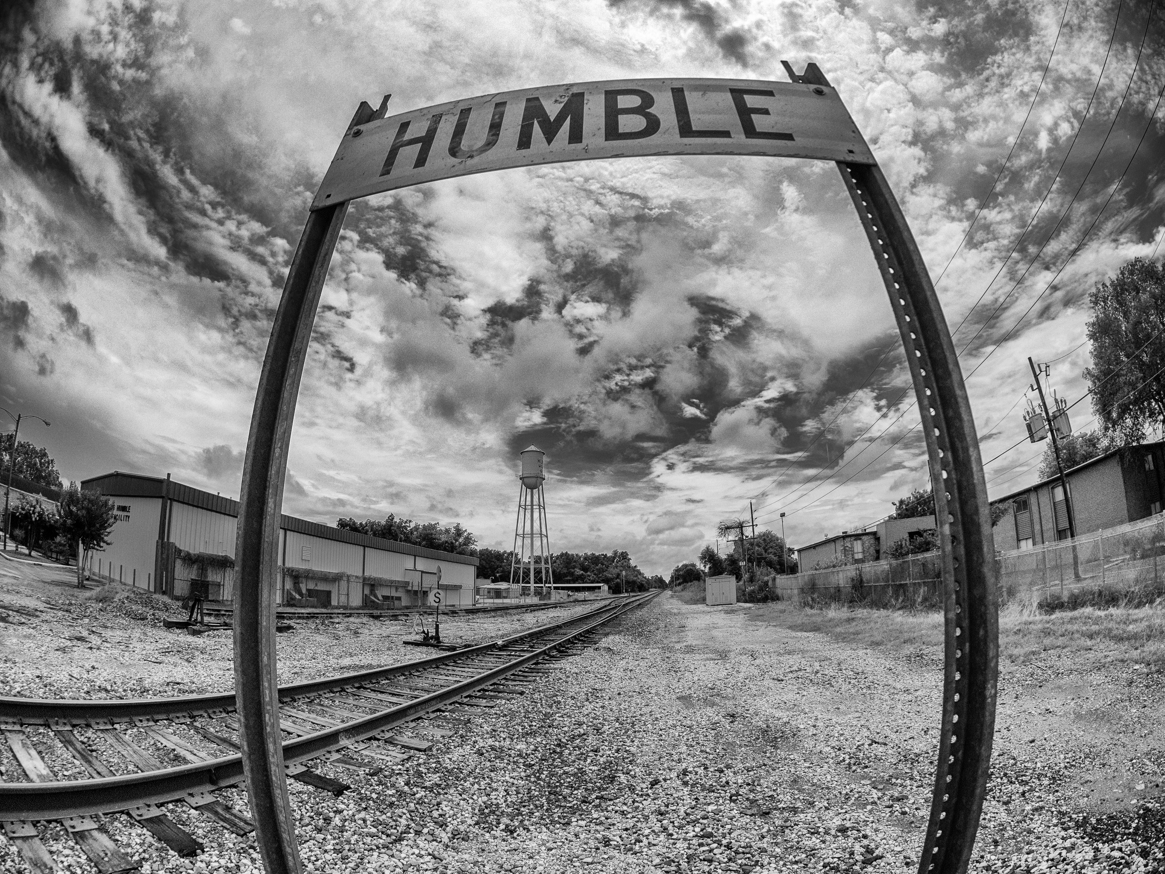 A sign along the railroad tracks indicating the town of Humble, Texas, USA, home of the Wildcats. FYI, the "H" is silent.