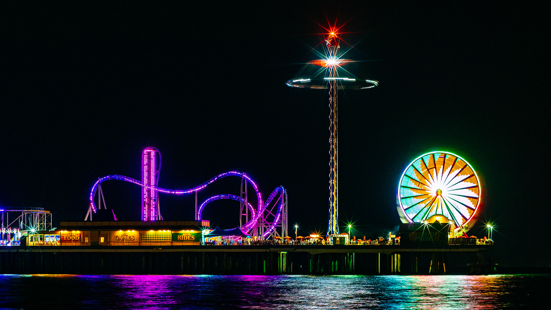 The beautiful Pleasure Pier in Galveston, Texas, USA.  Photograph taken with the amazing 42.5mm Voigtlander Nokton  stopped down f4.0.  The stars this lens produces when stopped down are one of my favorite things about it.