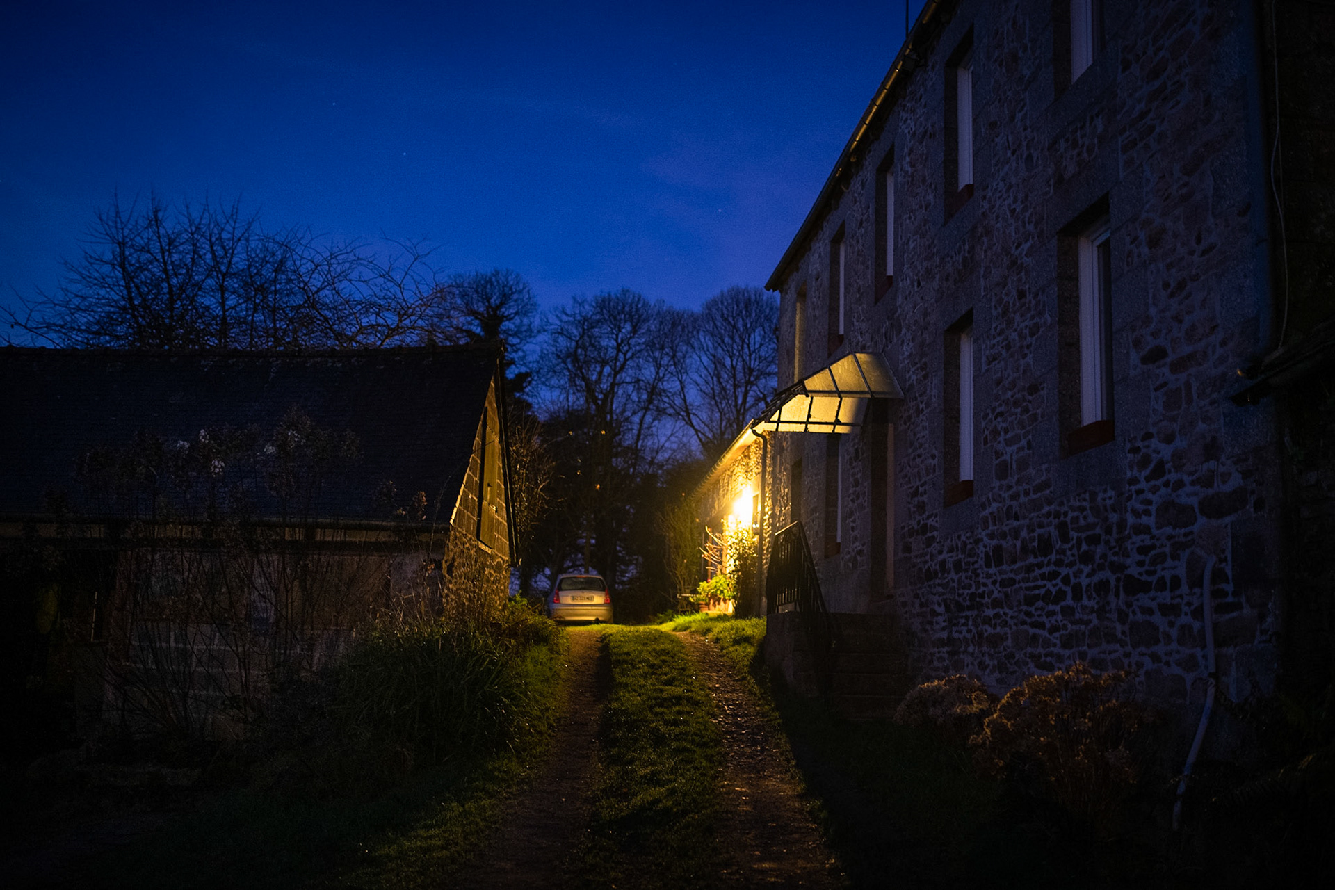 Pascal's house at daybreak. Pascal gets up very early in the morning to milk the cows.