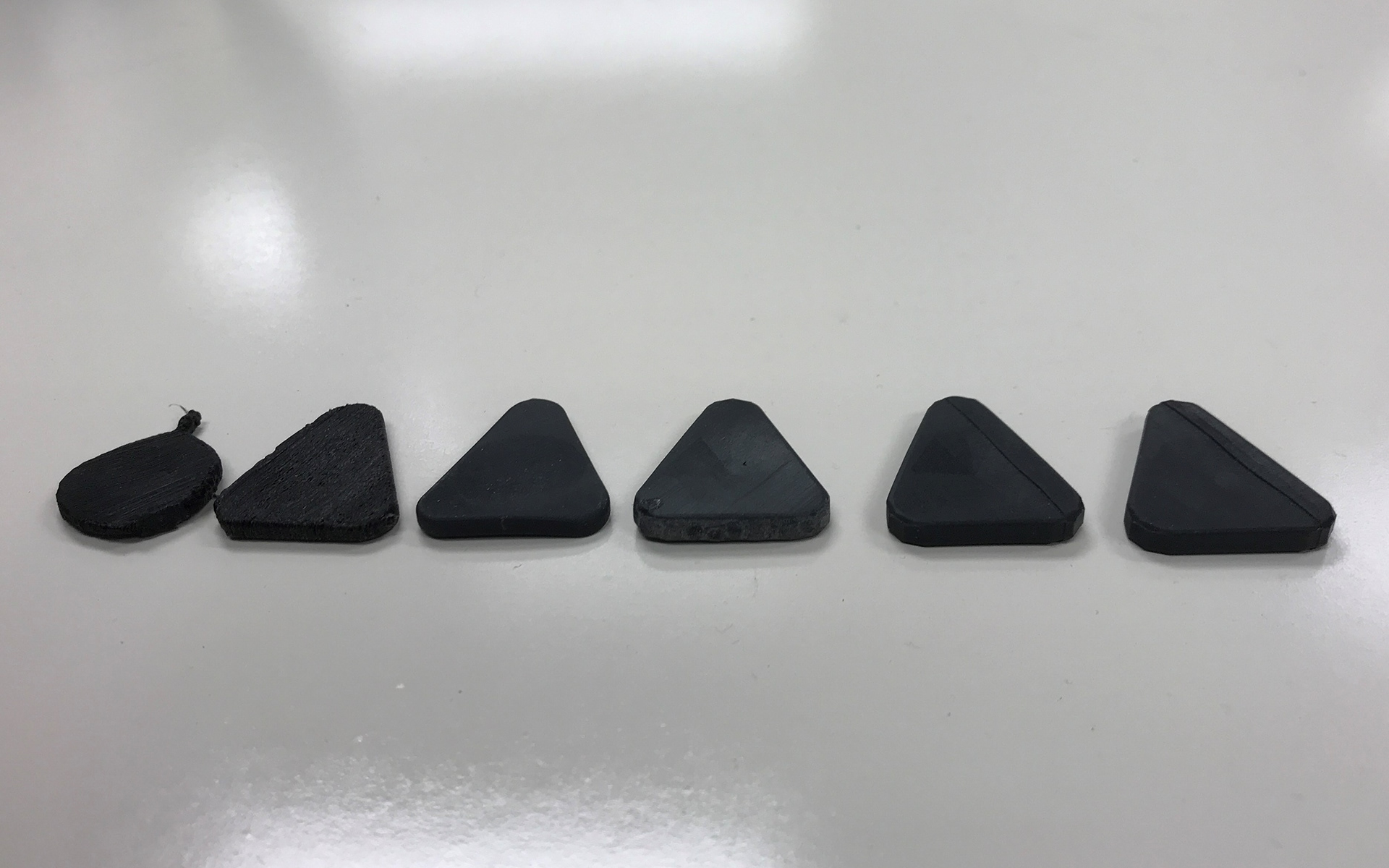 Pull-tab iterations. I modeled them in SOLIDWORKS, and took advantage of the on-campus 3D printers.
