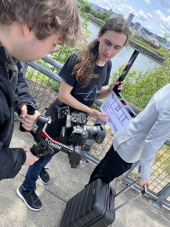 Prepping for a tracking shot under the steel bridge