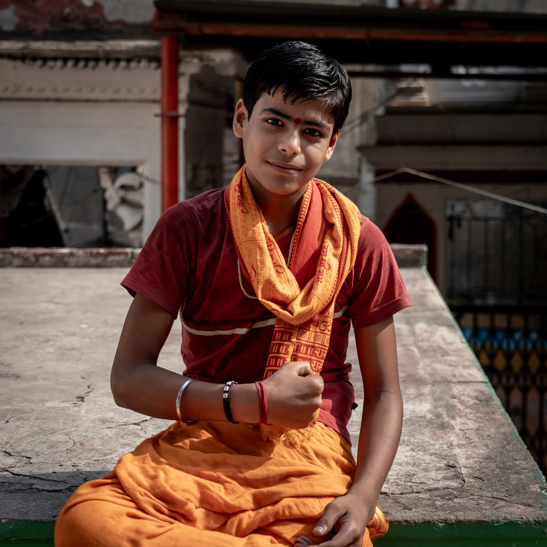 Vedic student in Varanasi showing off his guns