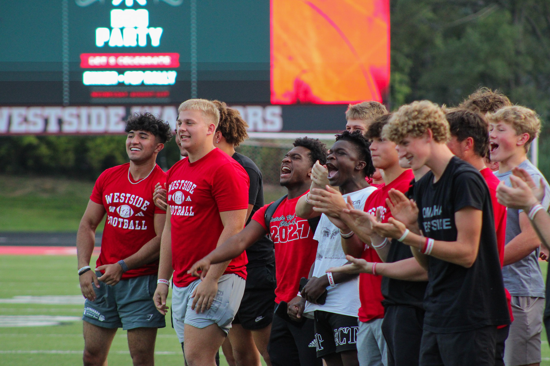 The underclassman of the Varsity Football team cheer as their senior teammates are announced.