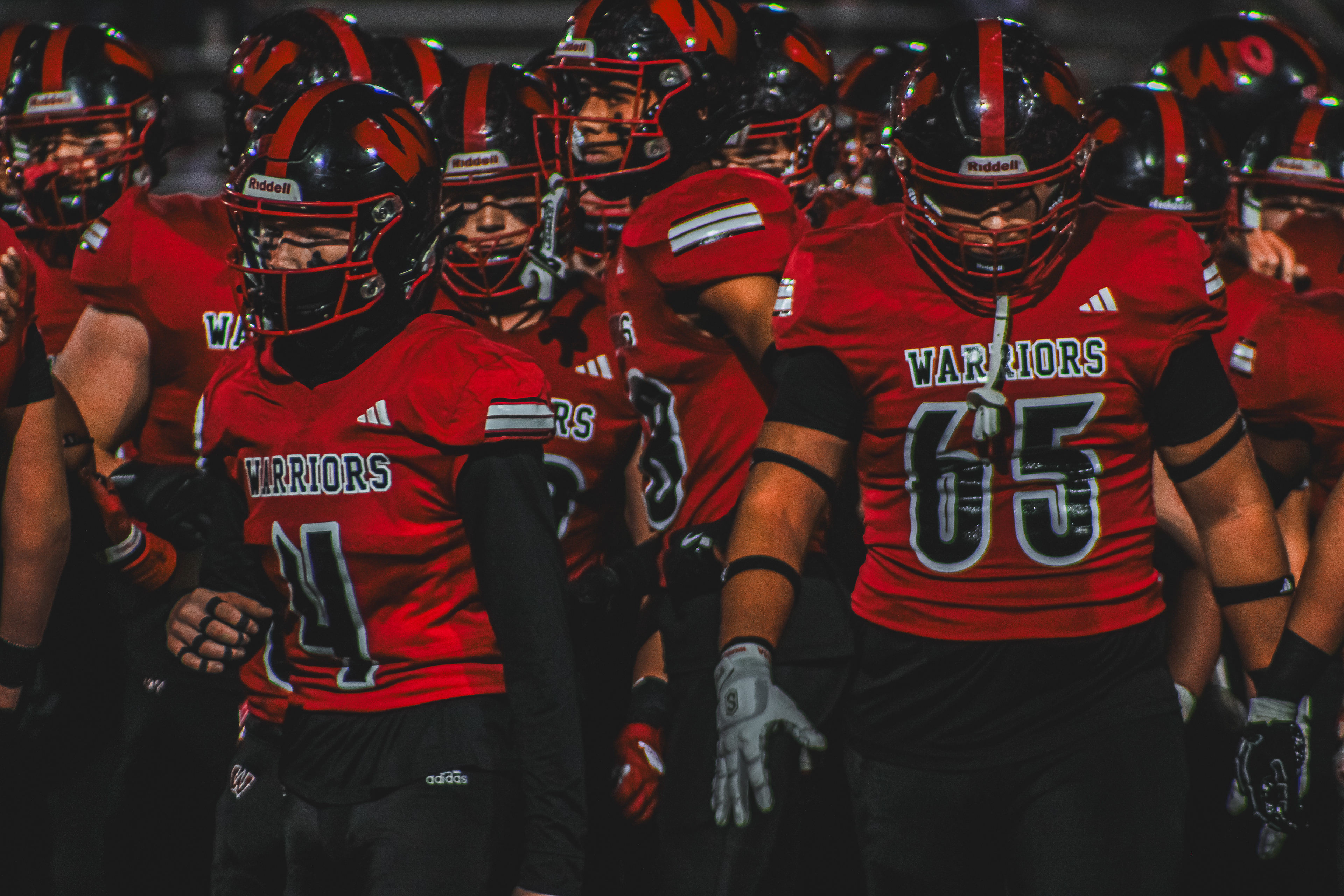 Warriors move down the side line as halftime comes to an end.