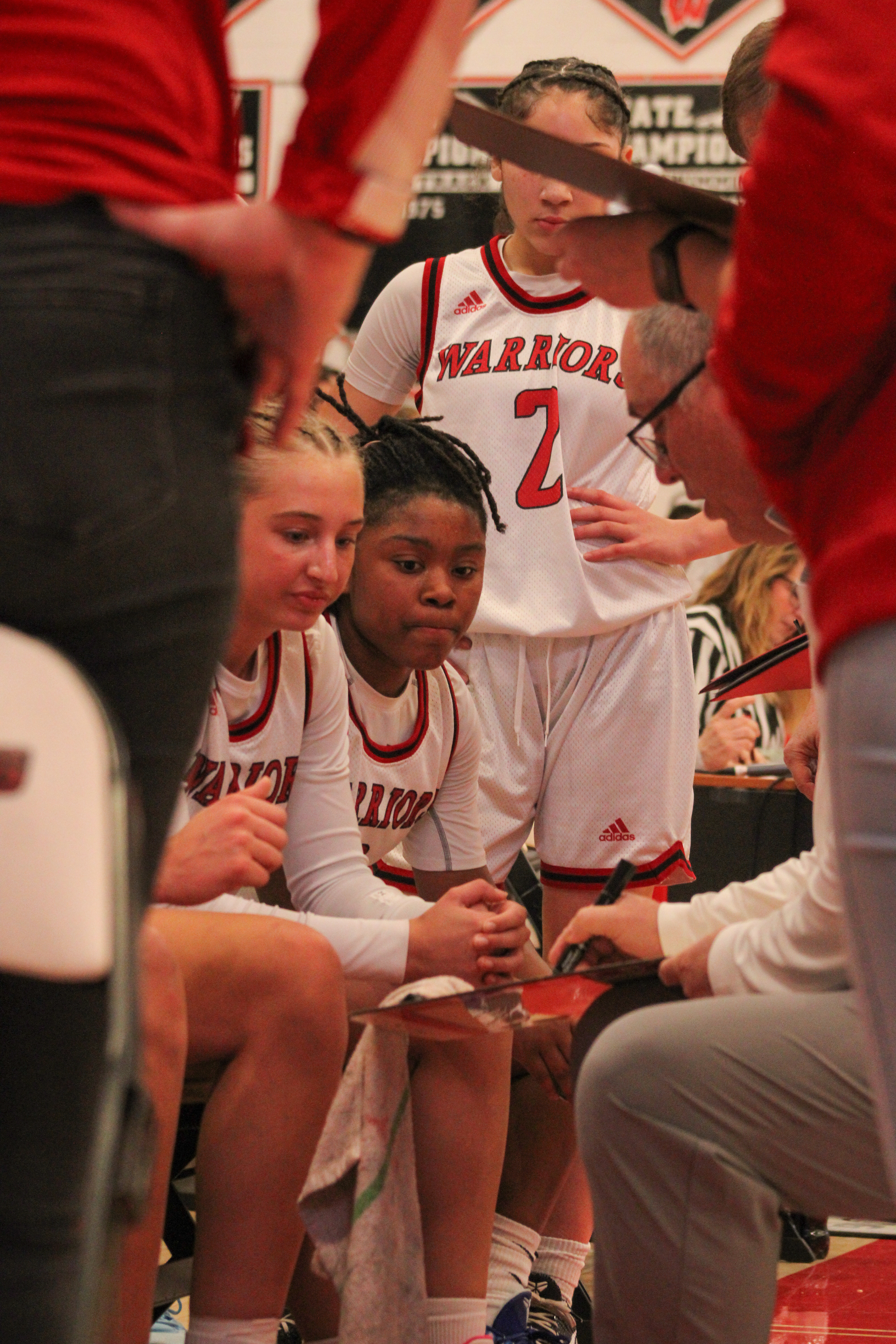Kathryn Gaughen and Himayajo Metoyer listen to their coach.