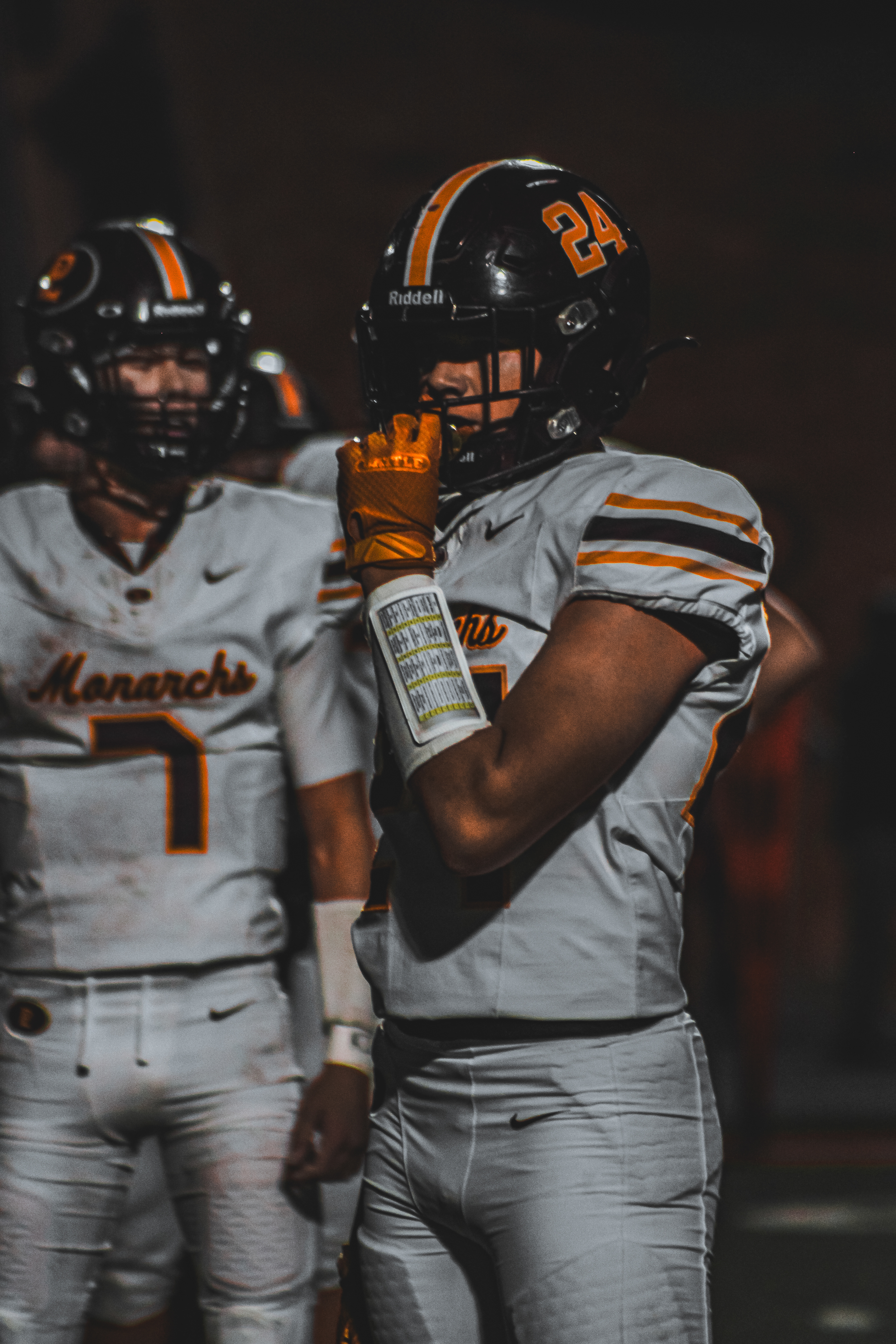 The Warrior Varsity Football team goes head to head with the Papillion-LaVista Monarch player adjusts his helmet while waiting for refs to make a call.