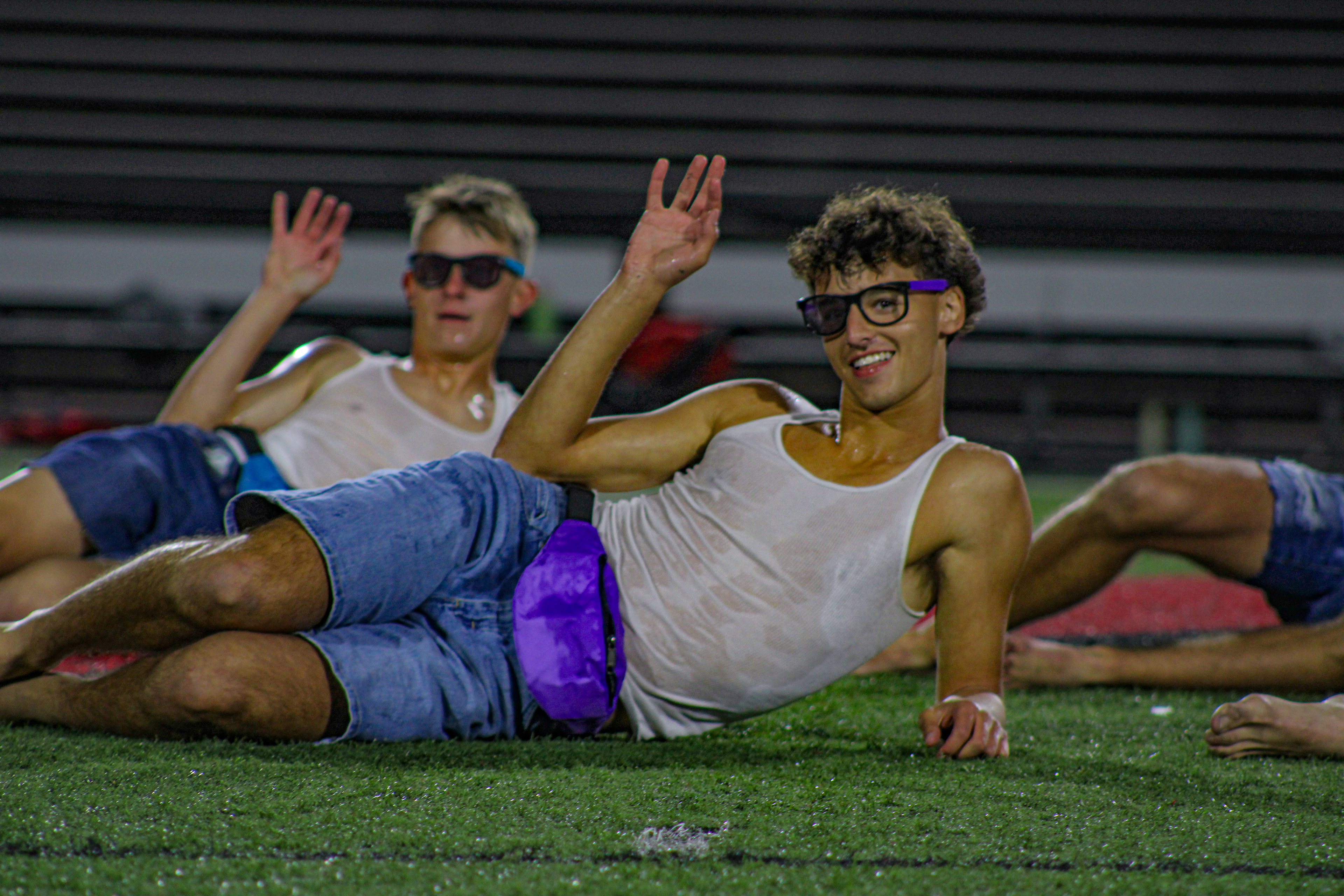 Senior Cody Myerson waves to the crowd during the Senior Dance portion of the annual Powder Puff game.