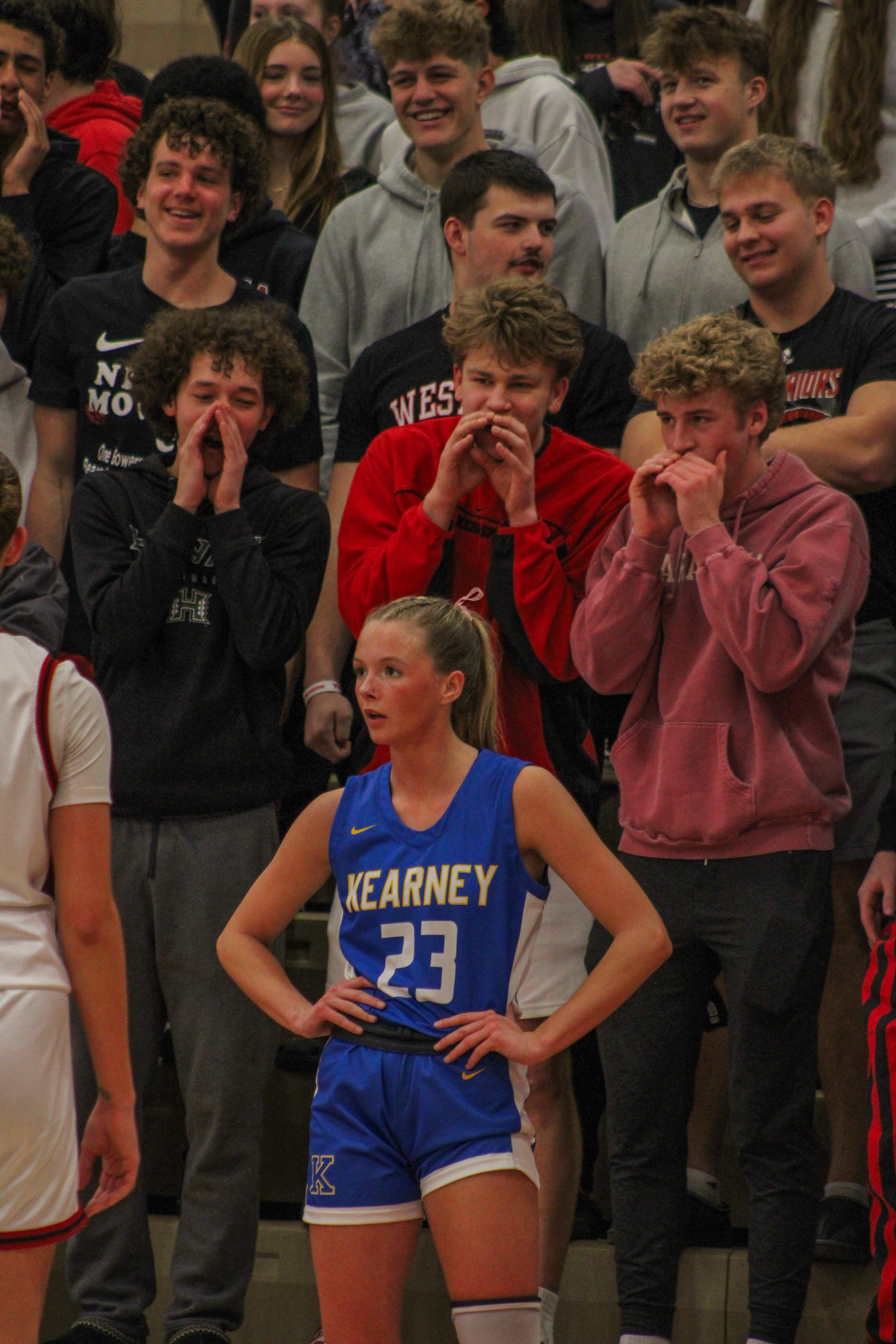 Senior Kelsey Hatcher stands on the court while the Westside student section barks at her