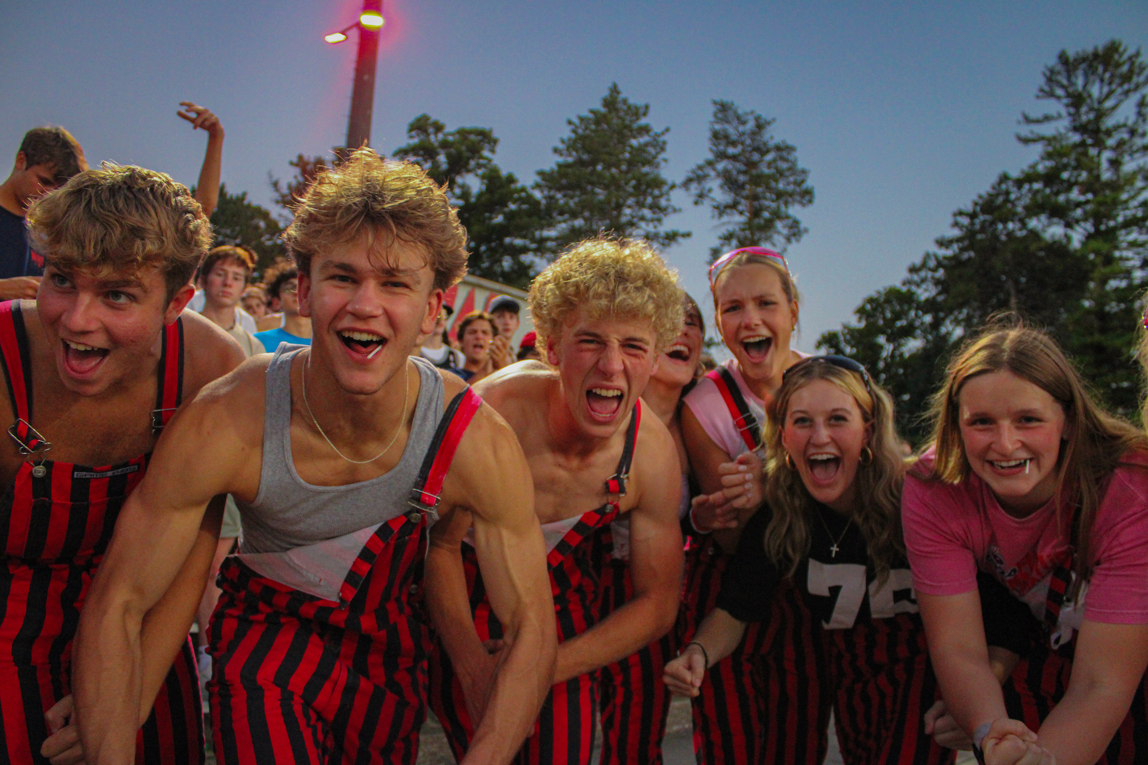 Red Shield Members cheer in excitement as the Warriors make their 7th touch down in a row.