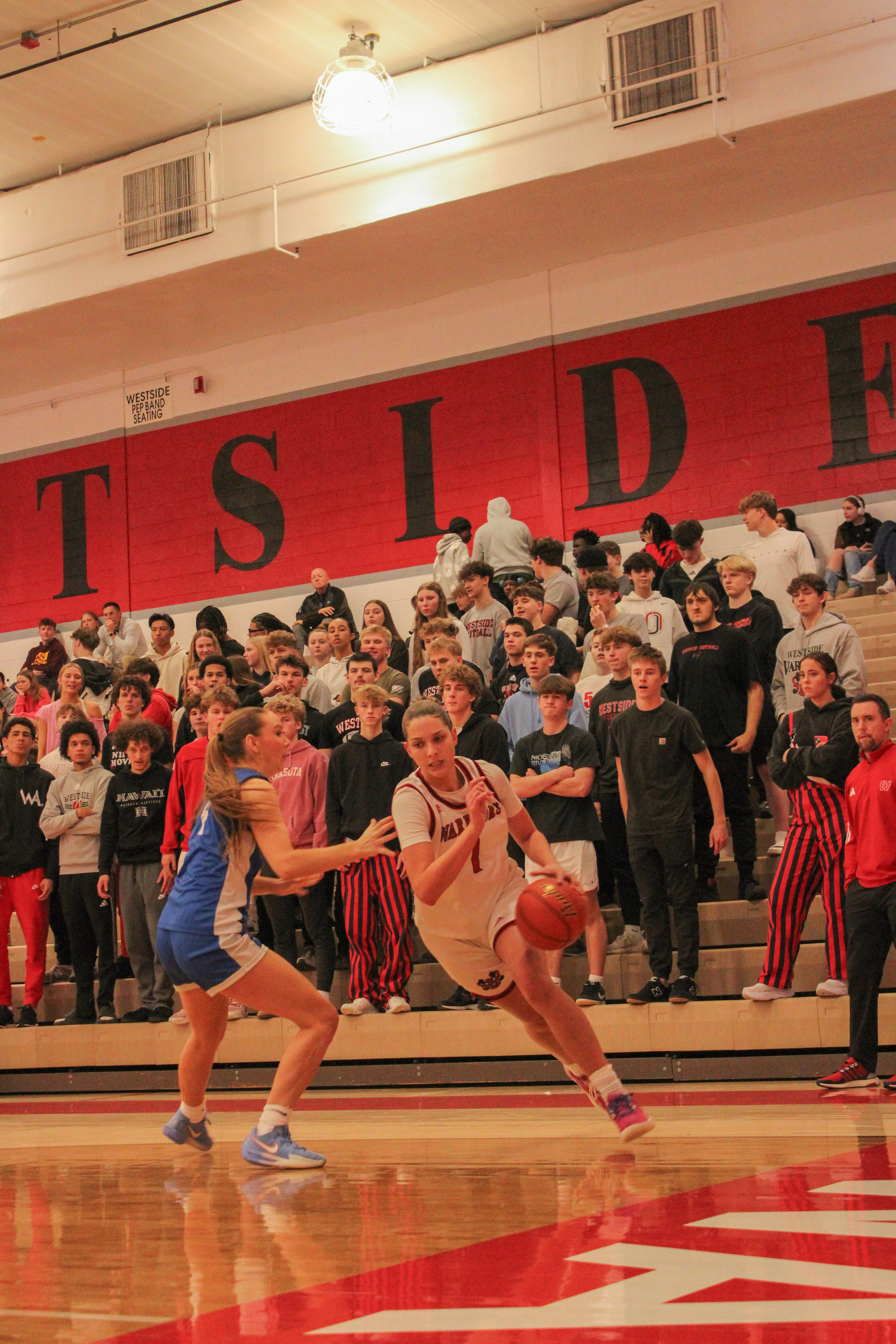 Sanai Foster dribbles the ball.
