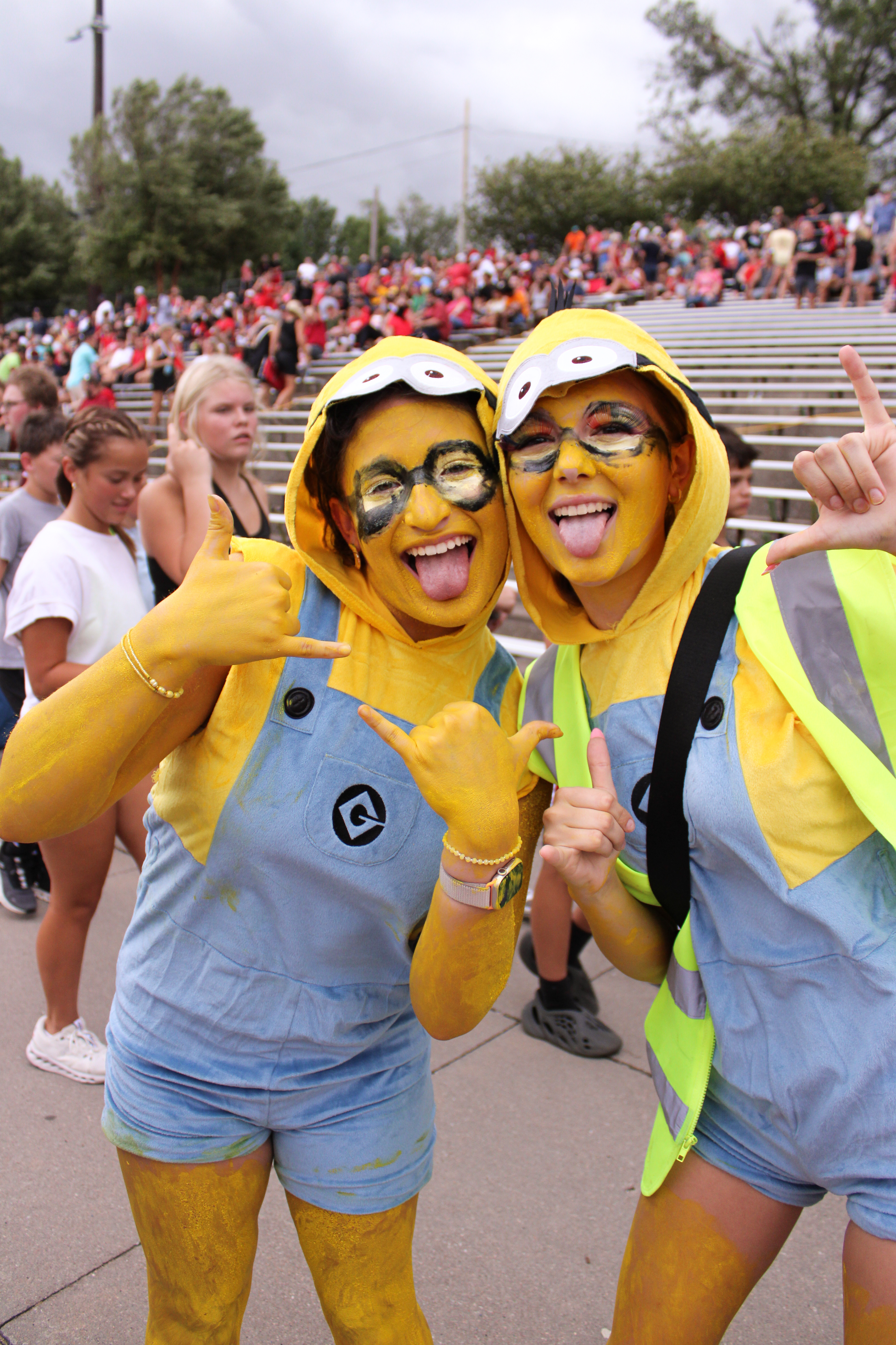 Junior Amelia Badilia and Junny Jone dress up as Minions for the Neon themed football game.