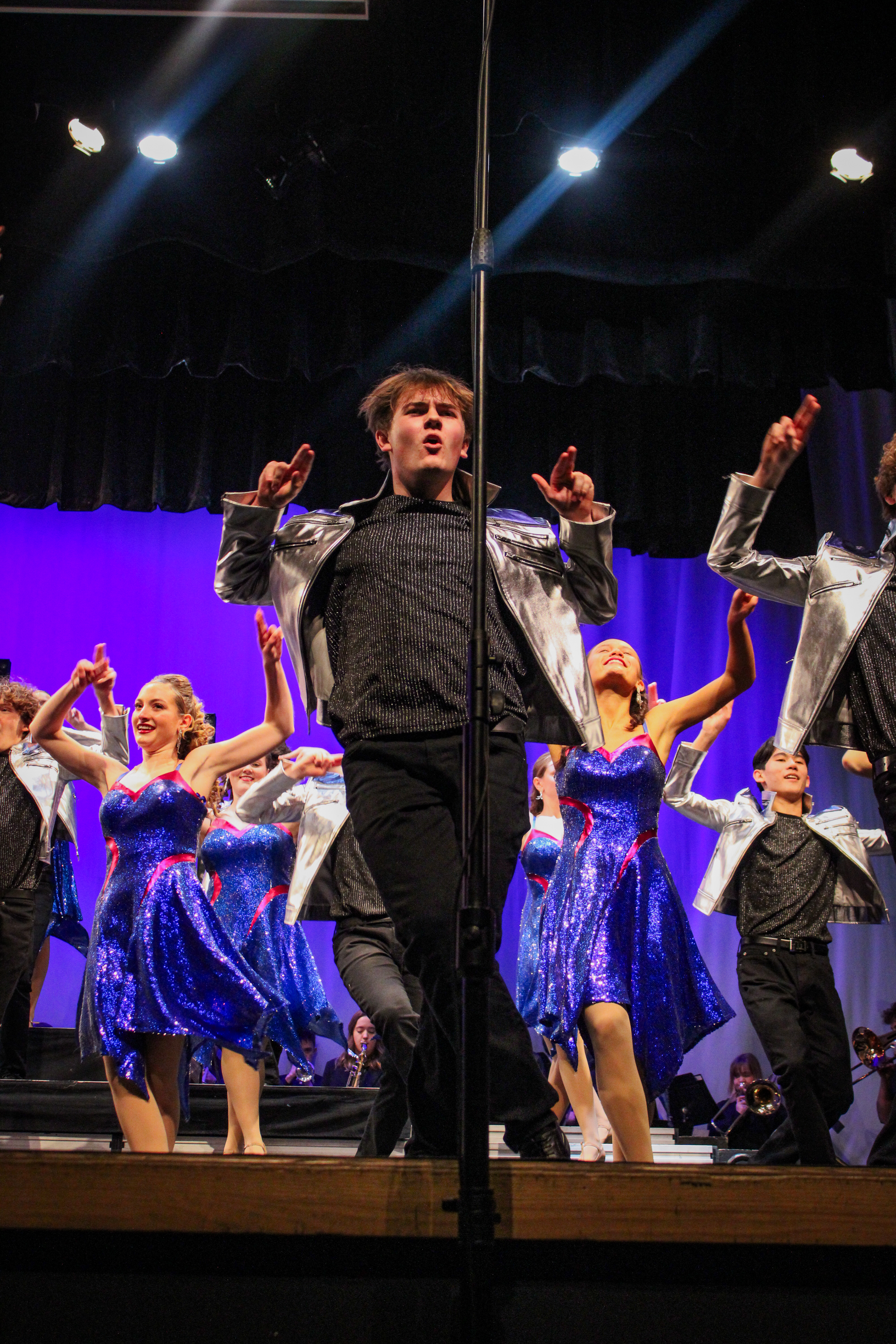 Junior Nick Day dances during the finale song of ATSC's show, "Moving Forward".