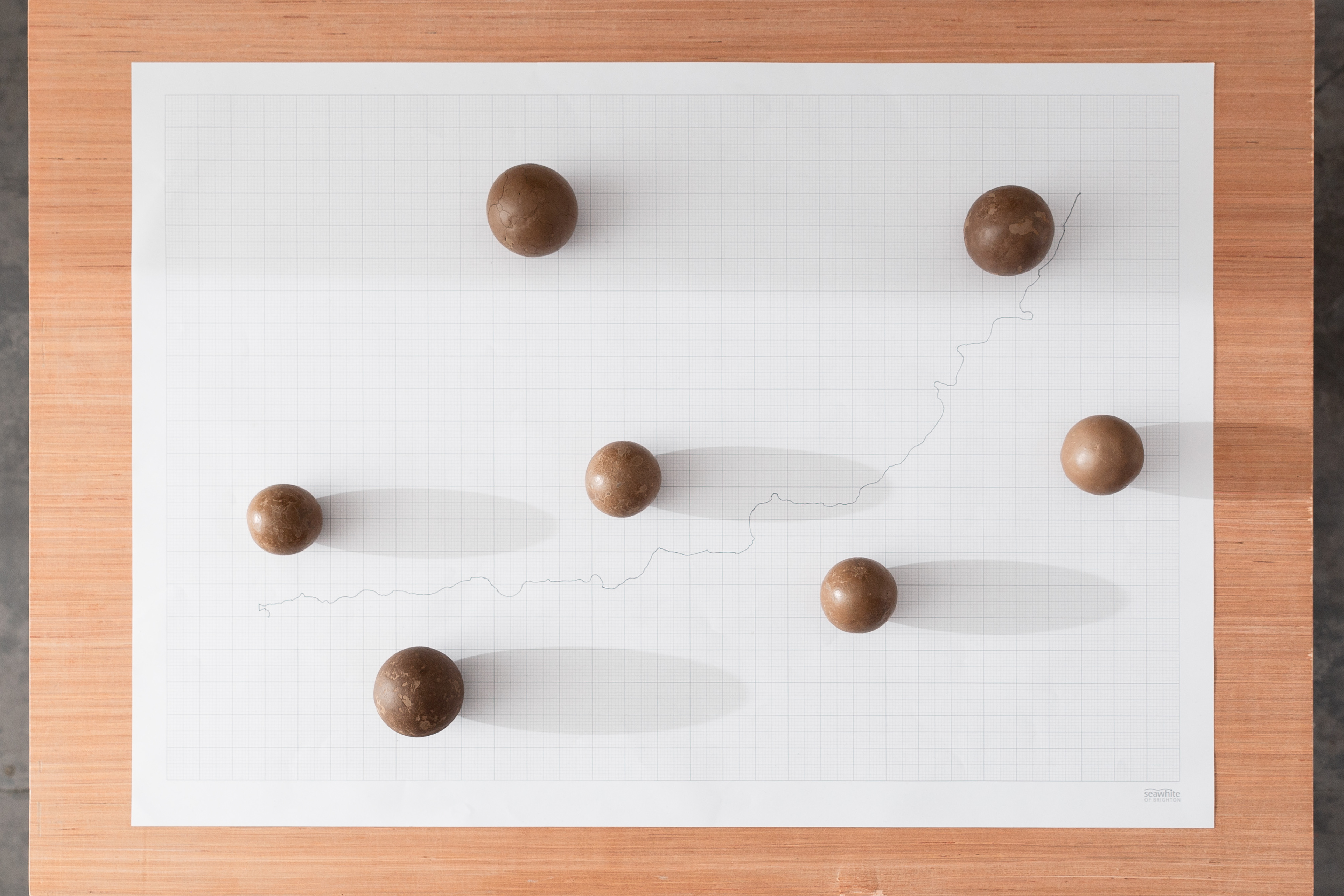 92.7km 2020 6 photographic prints, plywood, soil, glass, 7 polished soil spheres, Line drawing, 375 x 324 x 190 cm, installation view
