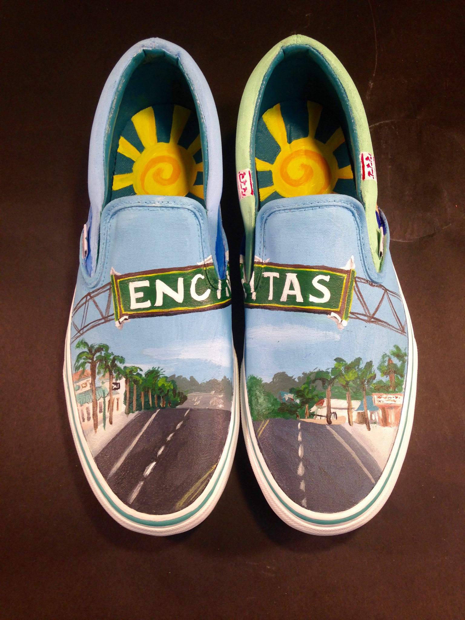 The top of the shoes features downtown Encinitas and its iconic sign