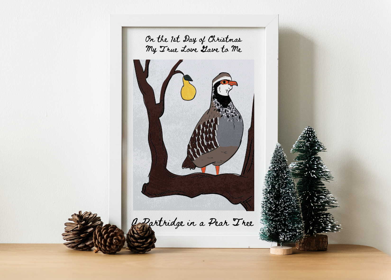 Framed illustration of a partridge in a pear tree surrounded by holiday decorations.