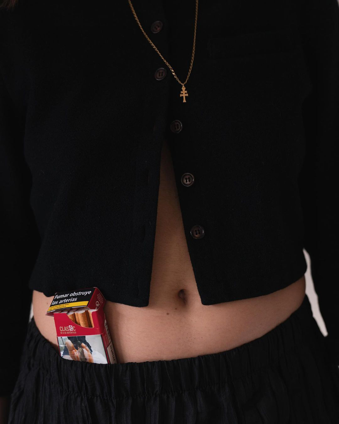 Photo 2. Me smoking my grandfather’s favourite cigarettes brand and wearing his necklace.
