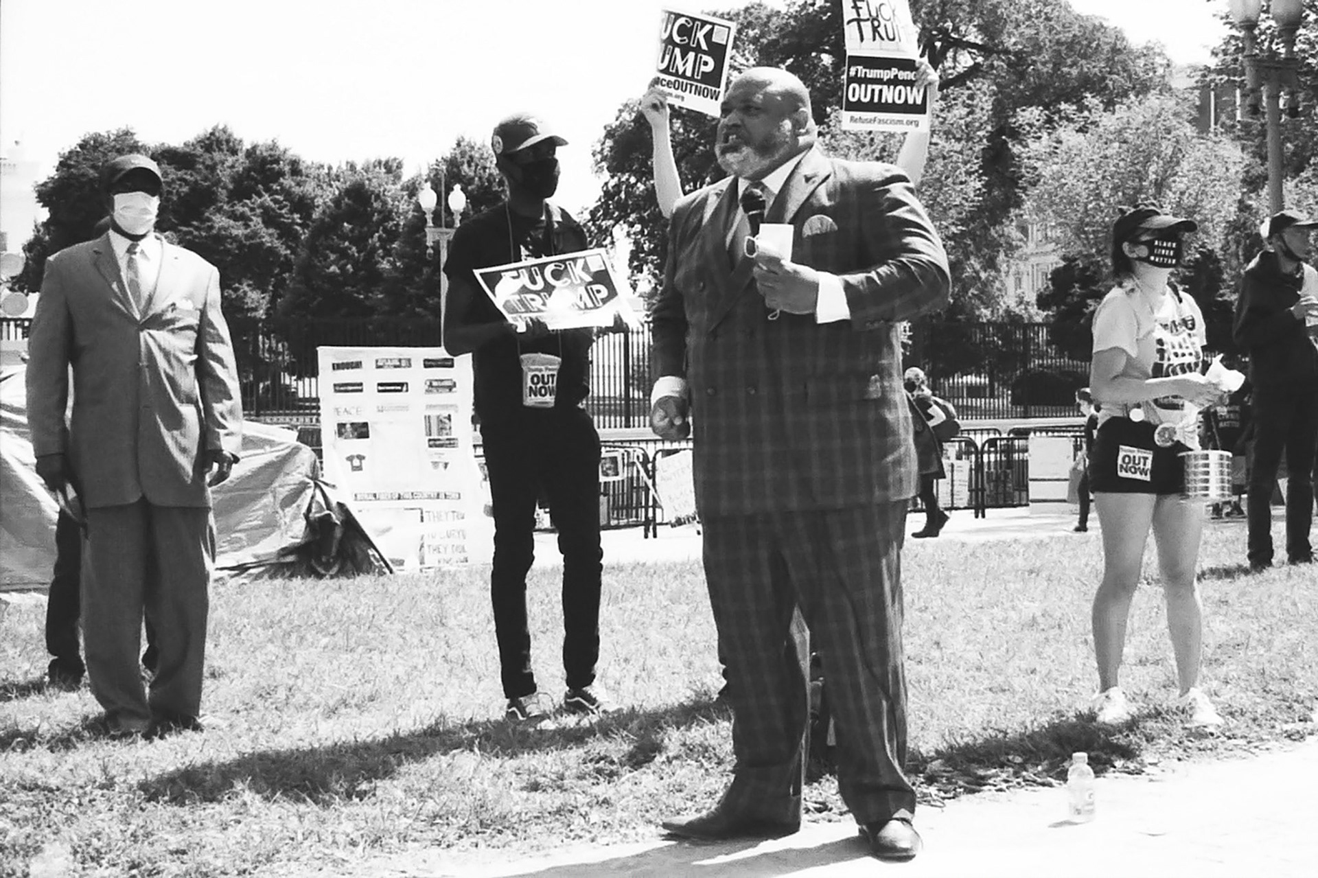 A man preaches in the heat at the protests in DC