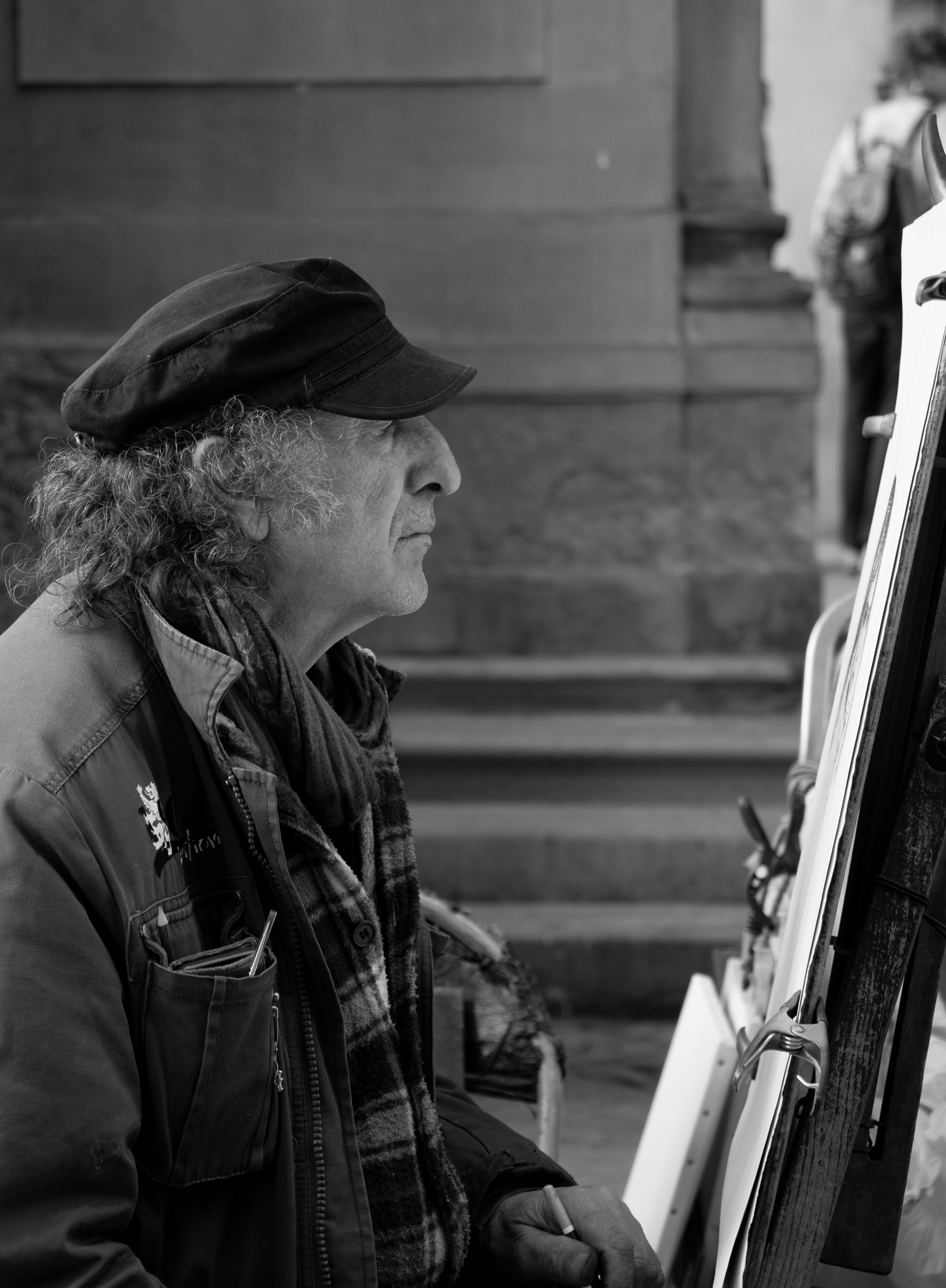 This man spends his days drawing portraits of people on the street, never taking time to admire his own profile.