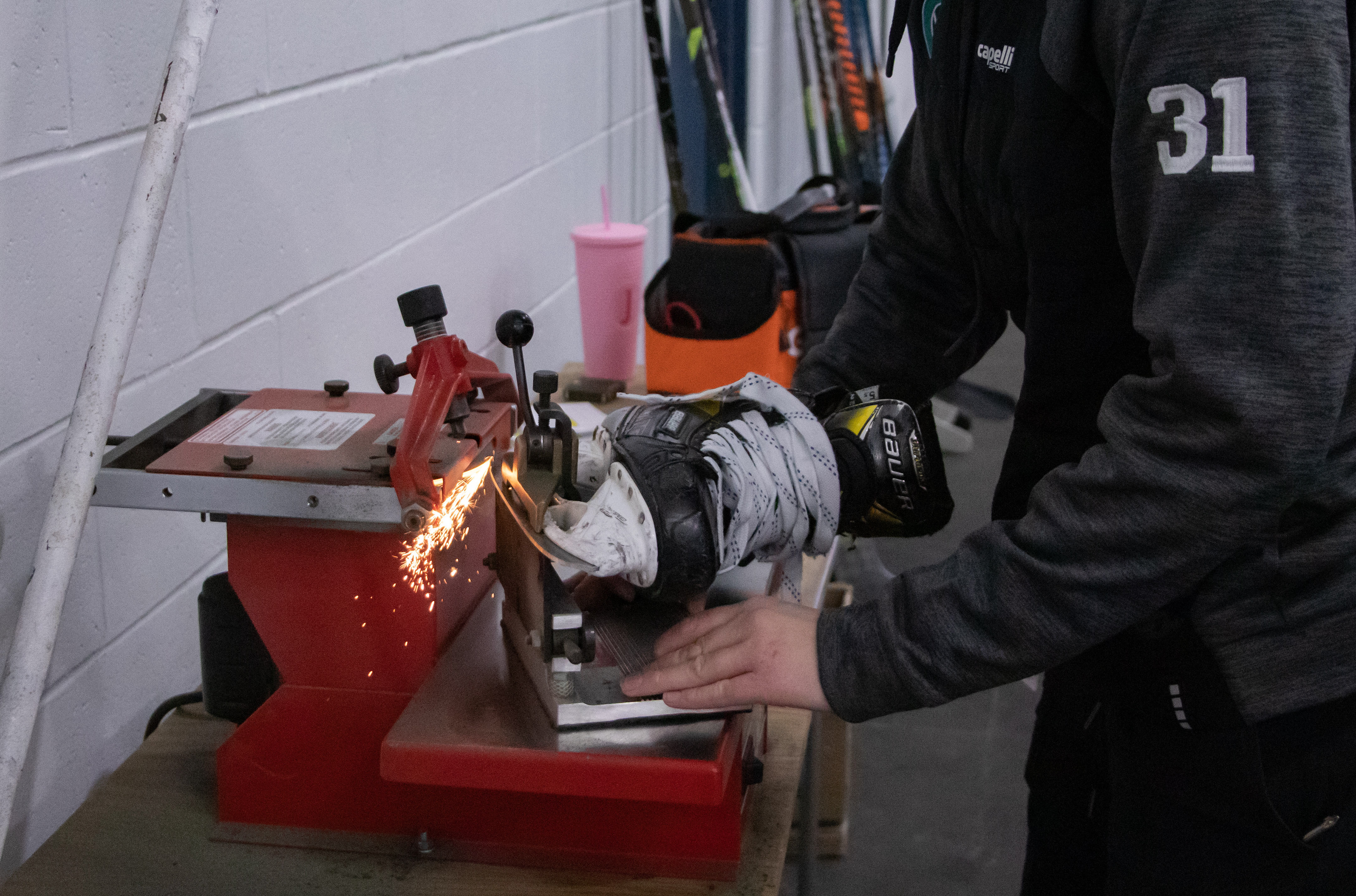Staying Sharp - There is a coaching and management staff behind the team as well. Jessica Strack (31) is the equipment manager for the Whale and makes sure the skate blades are sharpened before games start. She also has extra sticks on hand if one is broken during play. While there is not an army behind the scenes as there may be for teams in the NHL, the Whale team is mighty and they put their all into creating a professional environment for themselves and the team. 