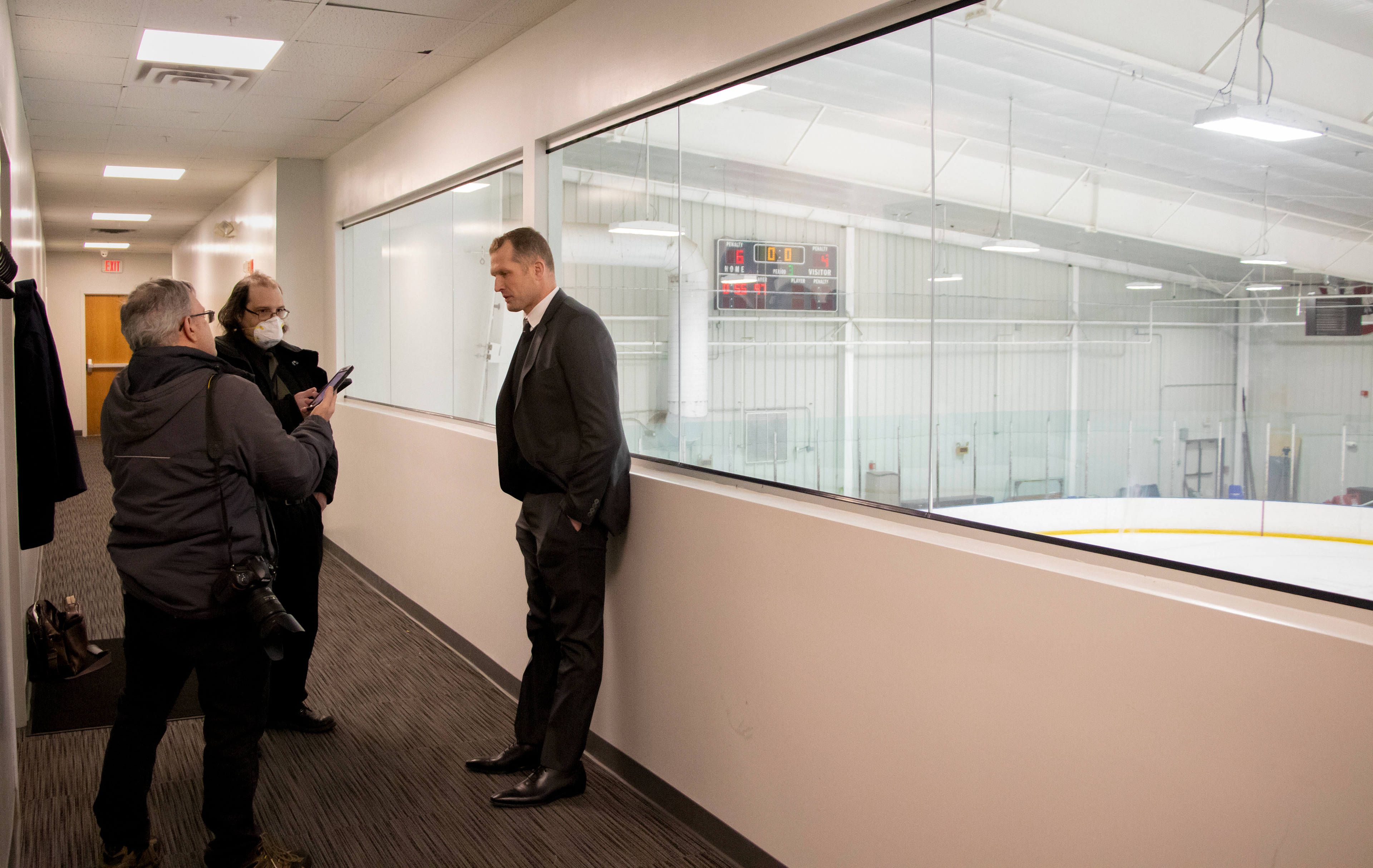 Room to Grow - While the ISCC rink in Simsbury does have private space for the team, there is not a designated media space. While there is not a heavy media presence at the games, there are local news organizations covering the games. The post-game media room for interviews, however, does not exist. Head Coach Colton Orr conducts his post-game interview with two reporters in the hallway above the rink after a 6-4 win against Toronto on Sunday, Feb. 19, 2023. There is also an empty workout studio that the reporters sometimes utilize for a little more privacy for their interviews. 