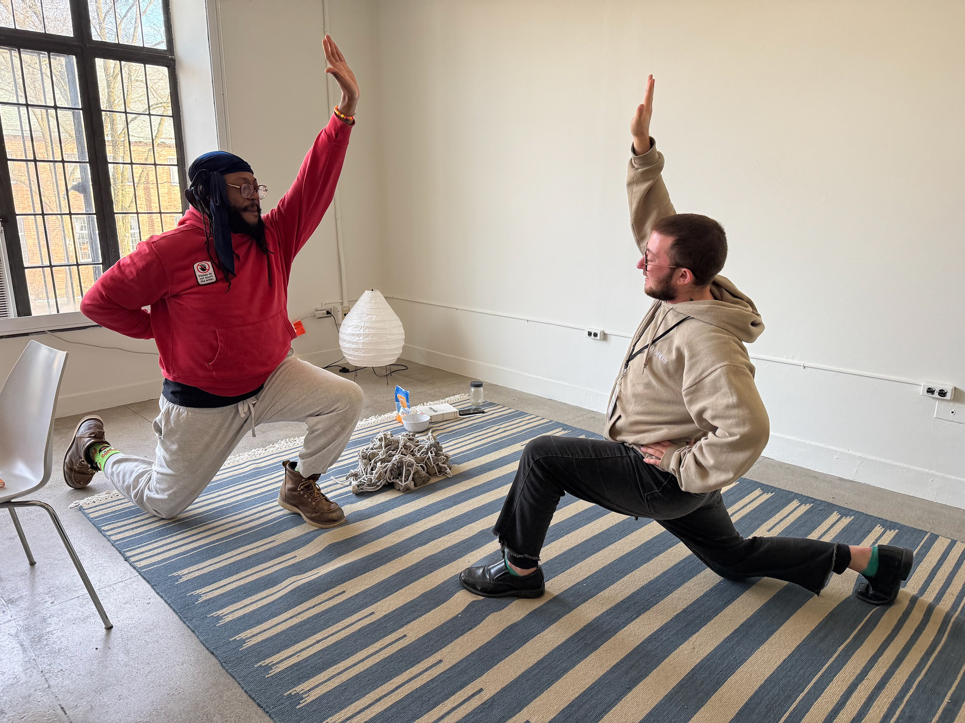 preparing my body to carry this weight by stretching with Christopher