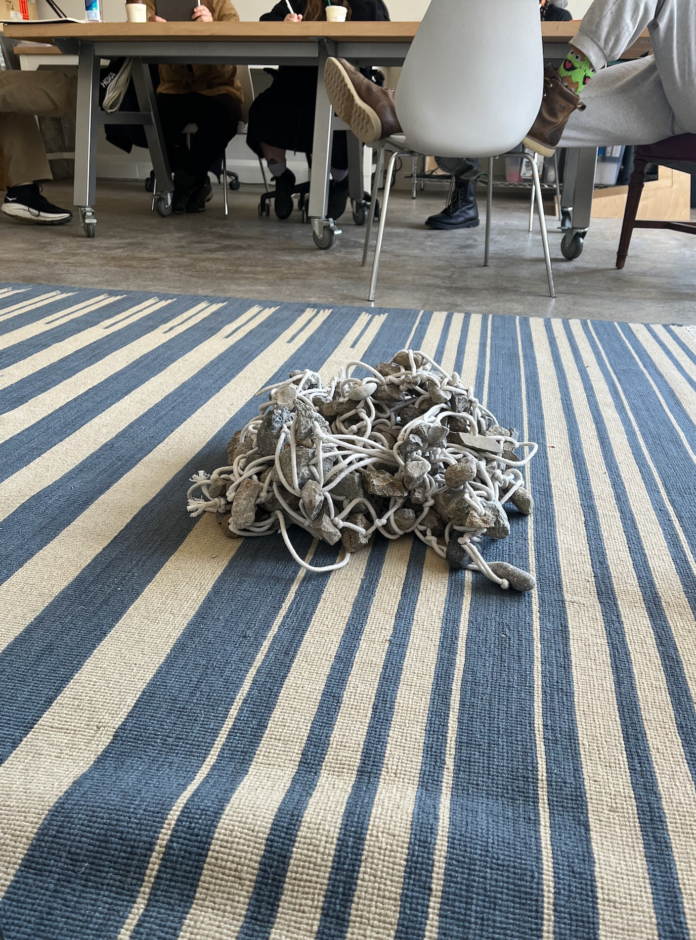 rocks on rug in Chris' studio during writing group