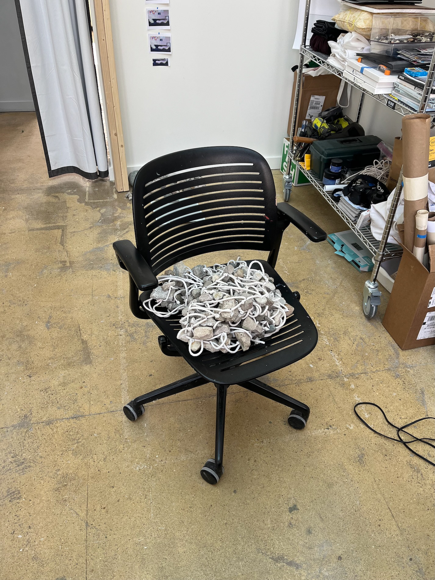 rocks on chair in studio