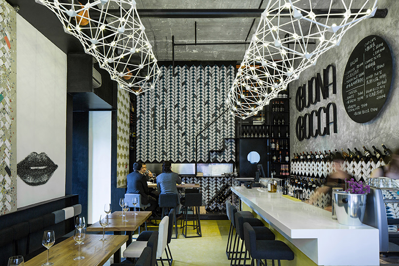 ramoprimo, interior design, wine bar, geometric chandeliers, brick patterns on walls,
