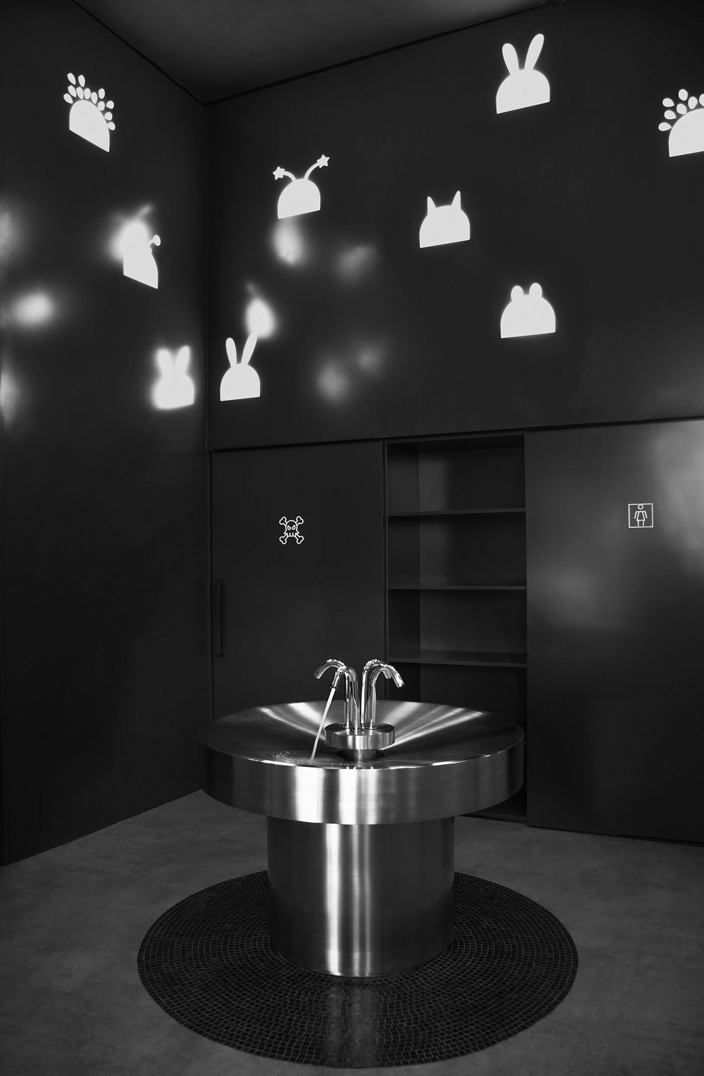 MFIT gym the black room with its dark tones and the central fountain is a space for rest and refresh design by RAMOPRIMO
